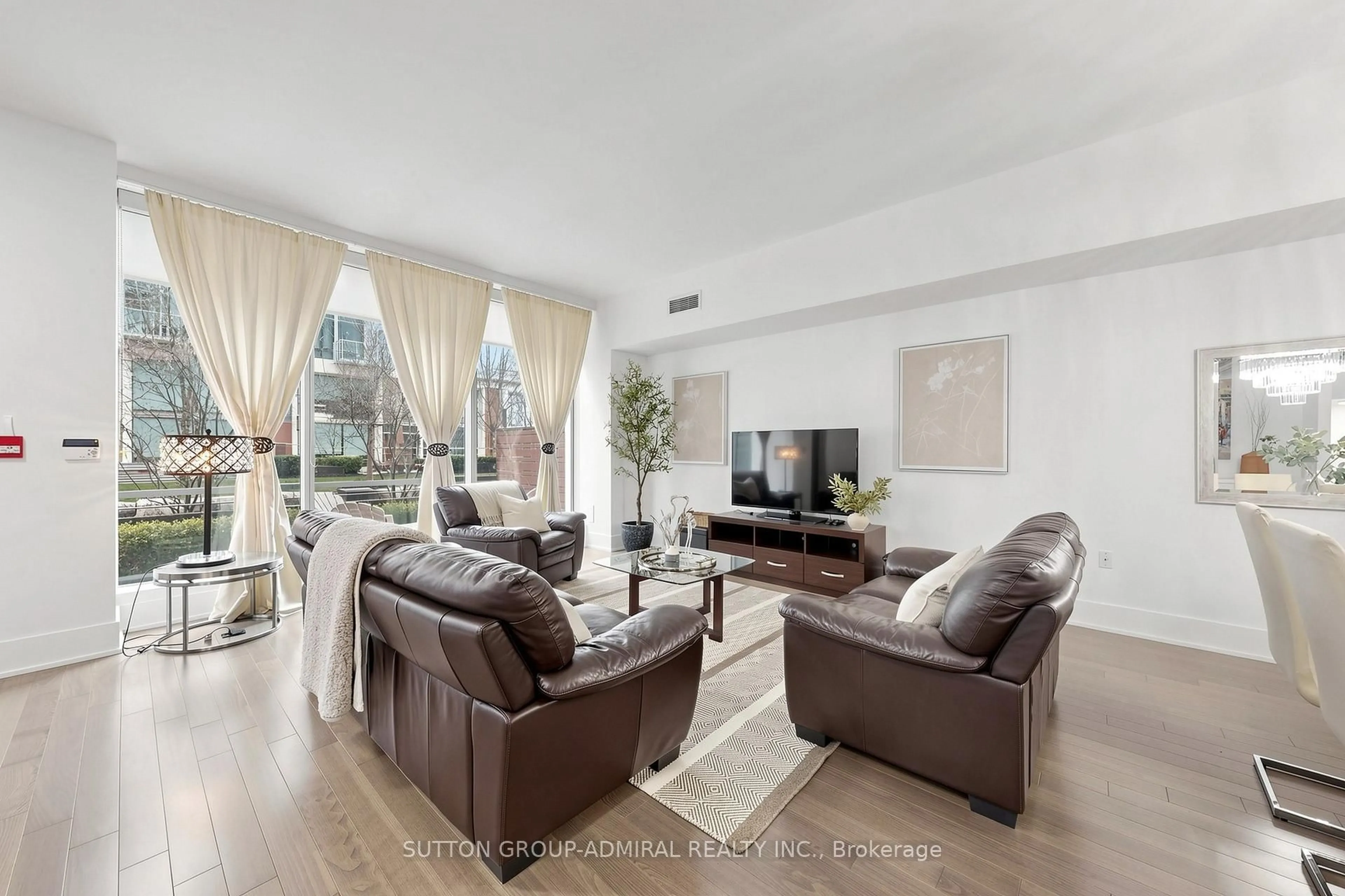 Living room with furniture, unknown for 39 Queens Quay #TH115, Toronto Ontario M5E 0A5
