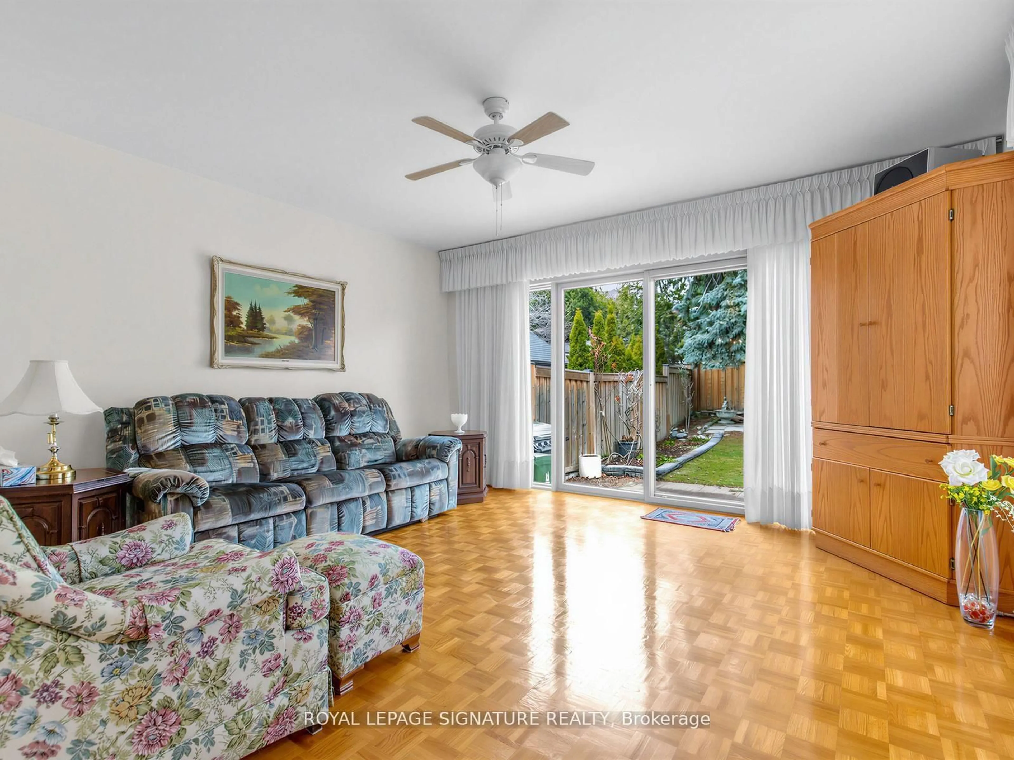 Living room with furniture, wood/laminate floor for 136 Cranbrooke Ave, Toronto Ontario M5M 1M5