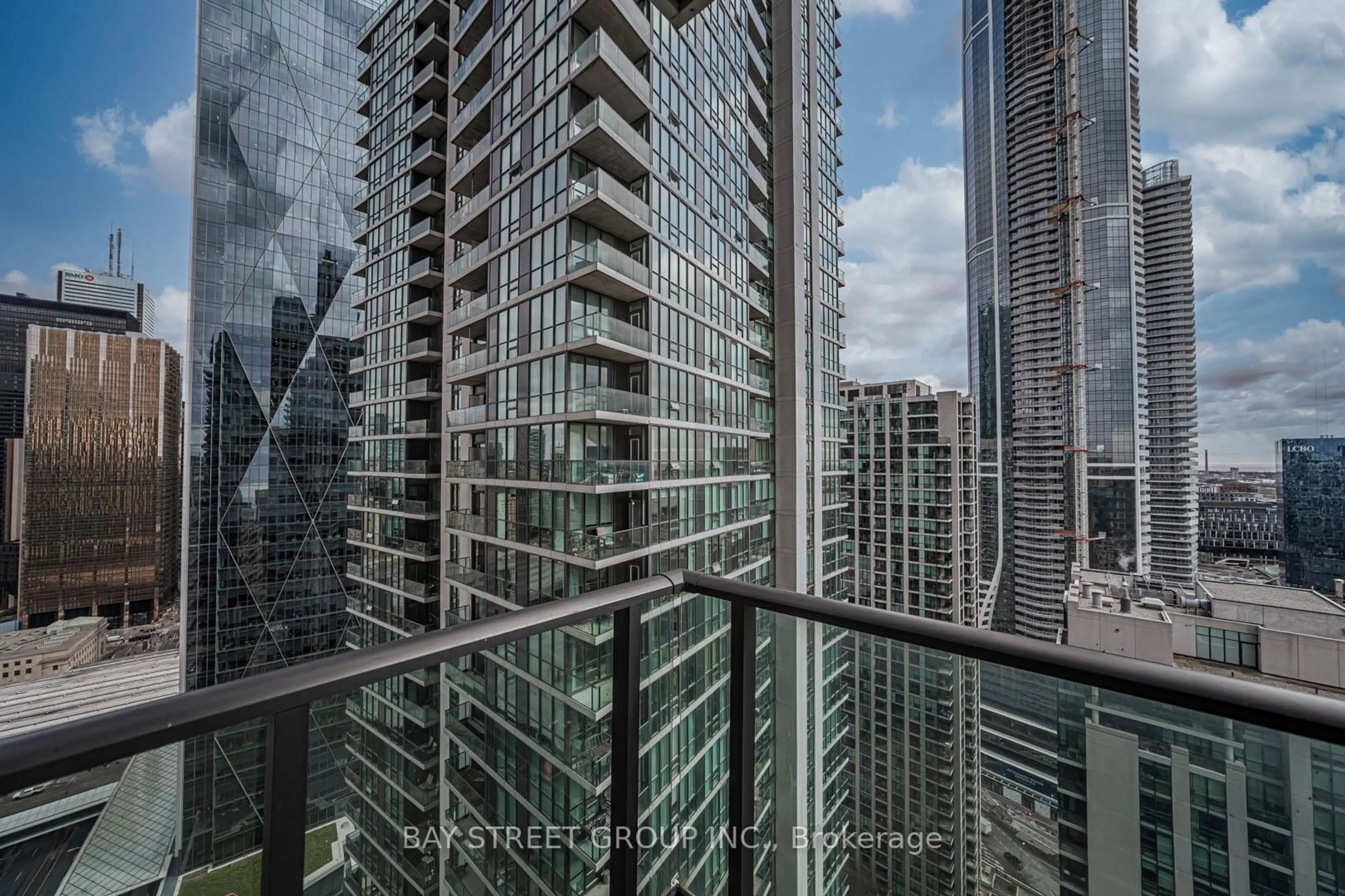 Balcony in the apartment, city buildings view from balcony for 33 Bay St #3606, Toronto Ontario M5J 2Z3