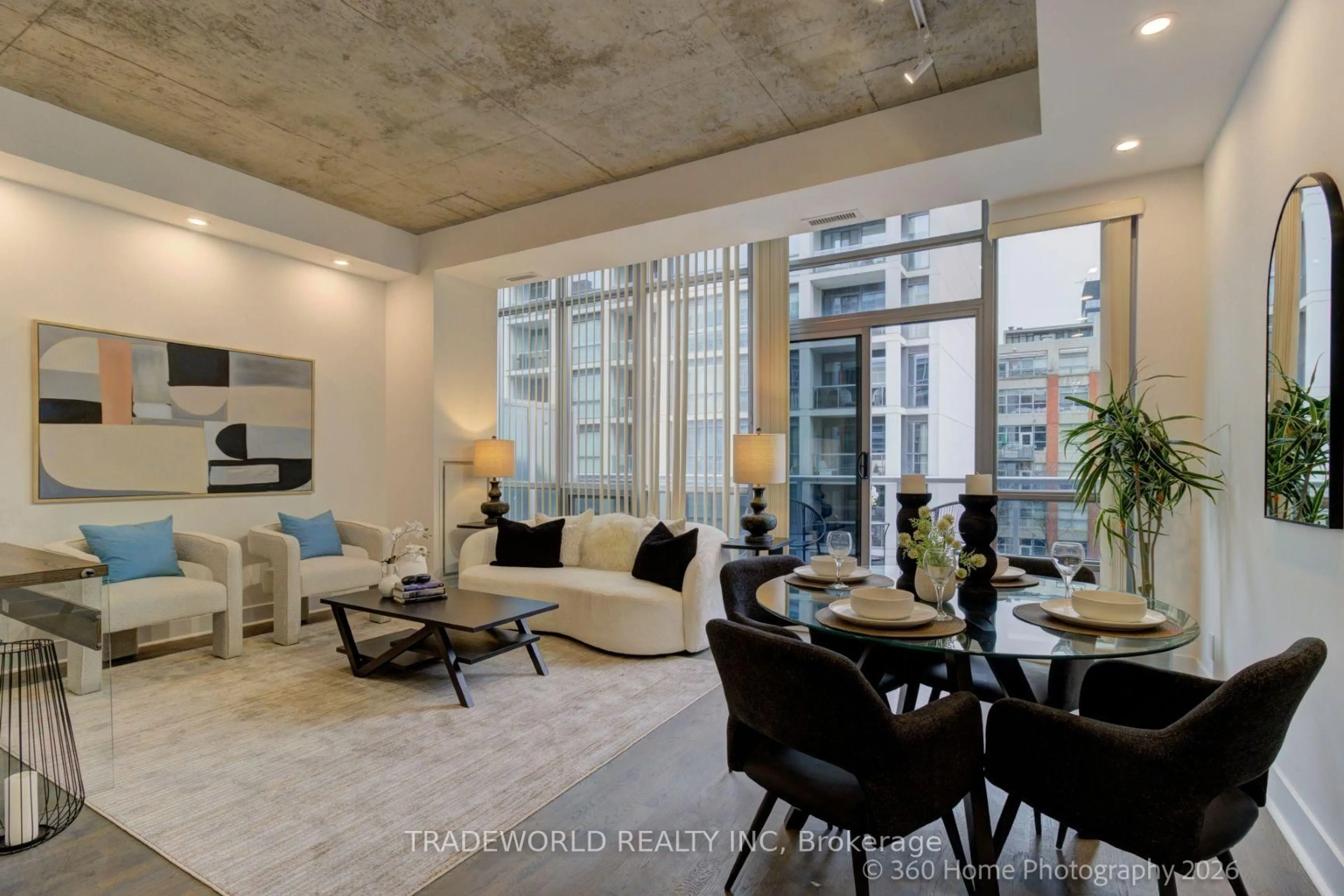 Living room with furniture, cement floor for 399 Adelaide St #603, Toronto Ontario M5V 1S4