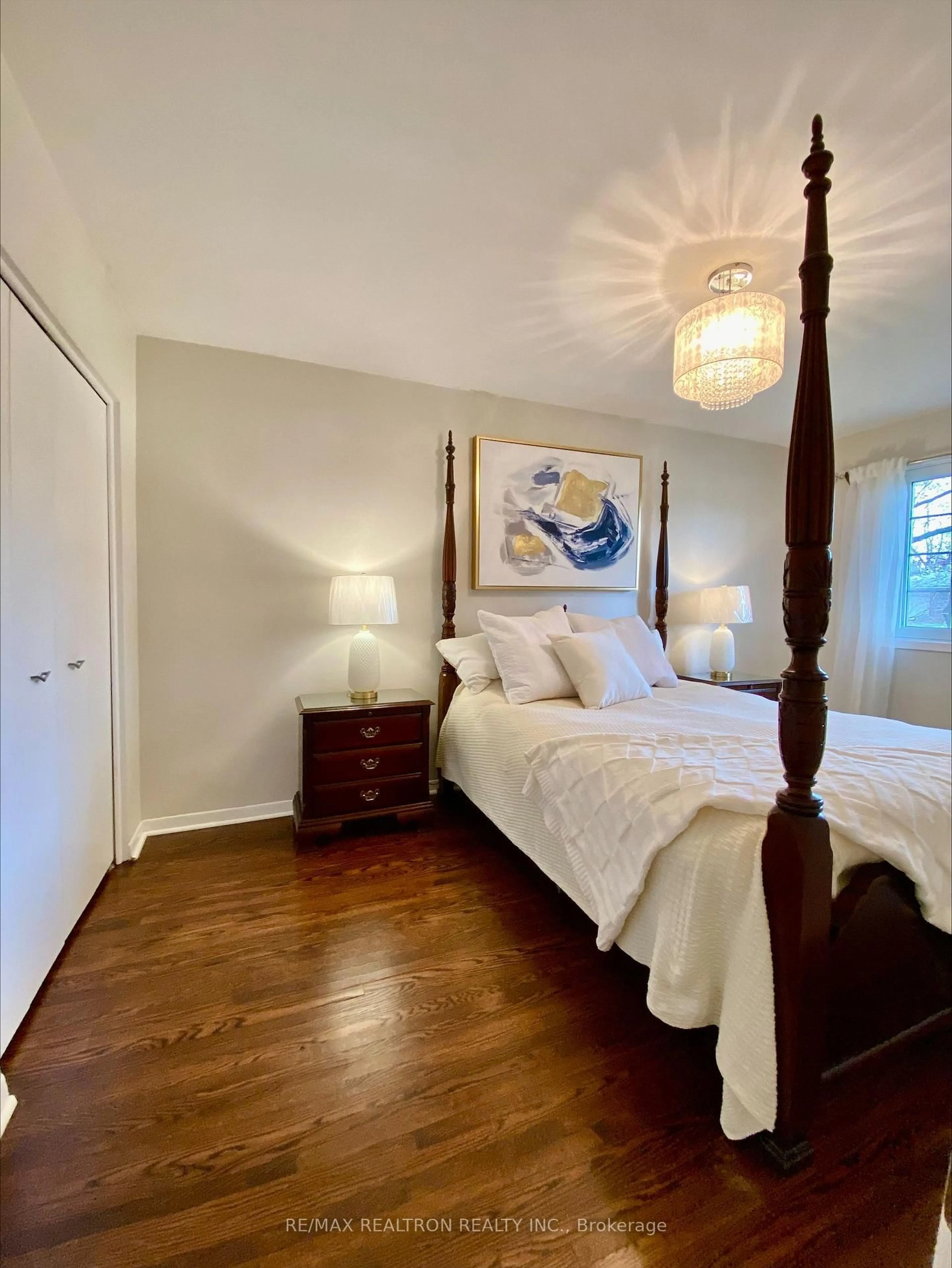Bedroom with bed, wood/laminate floor for 42 Resolution Cres, Toronto Ontario M2H 1N4
