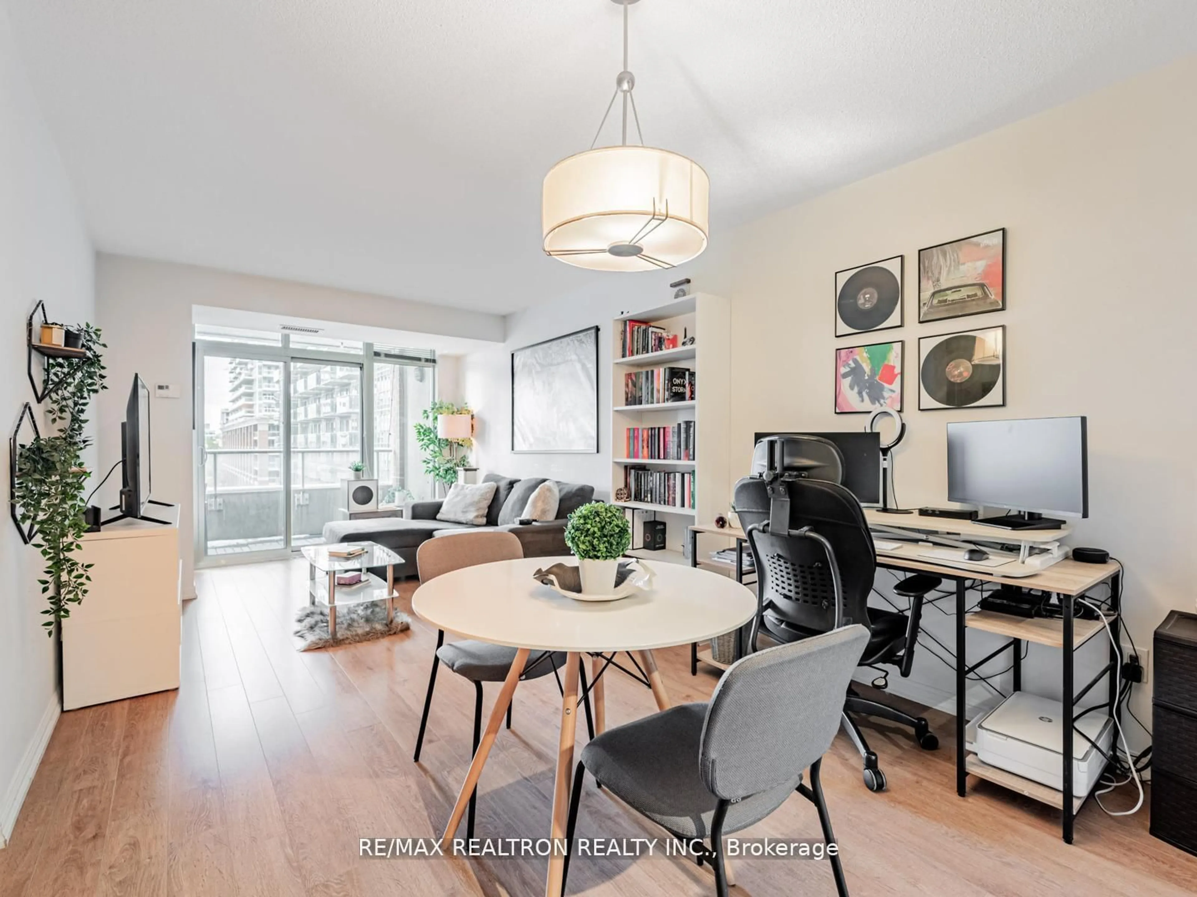 Living room with furniture, wood/laminate floor for 85 East Liberty St #716, Toronto Ontario M6K 3R4