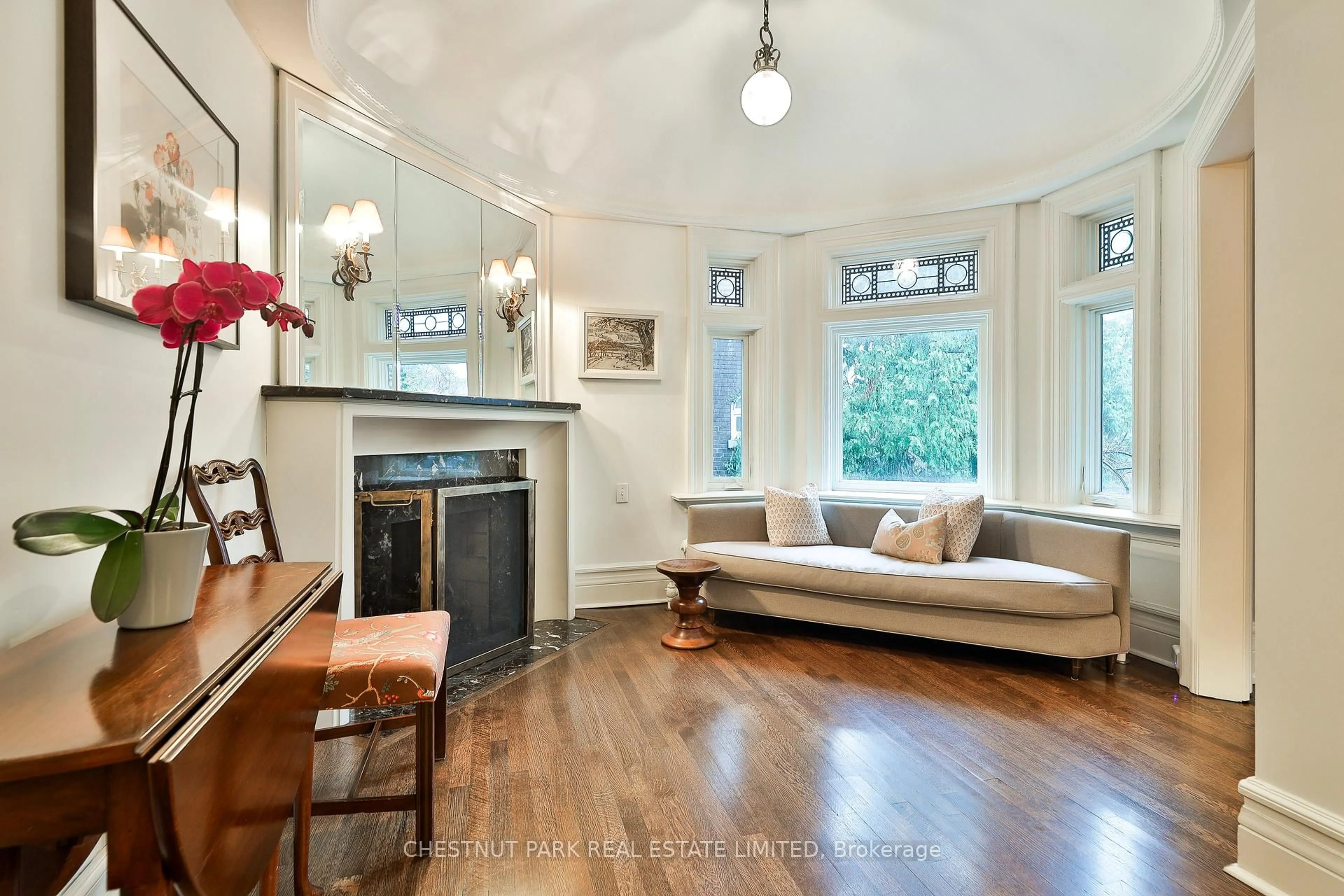 Living room with furniture, wood/laminate floor for 17 Elm Ave, Toronto Ontario M4W 1M9