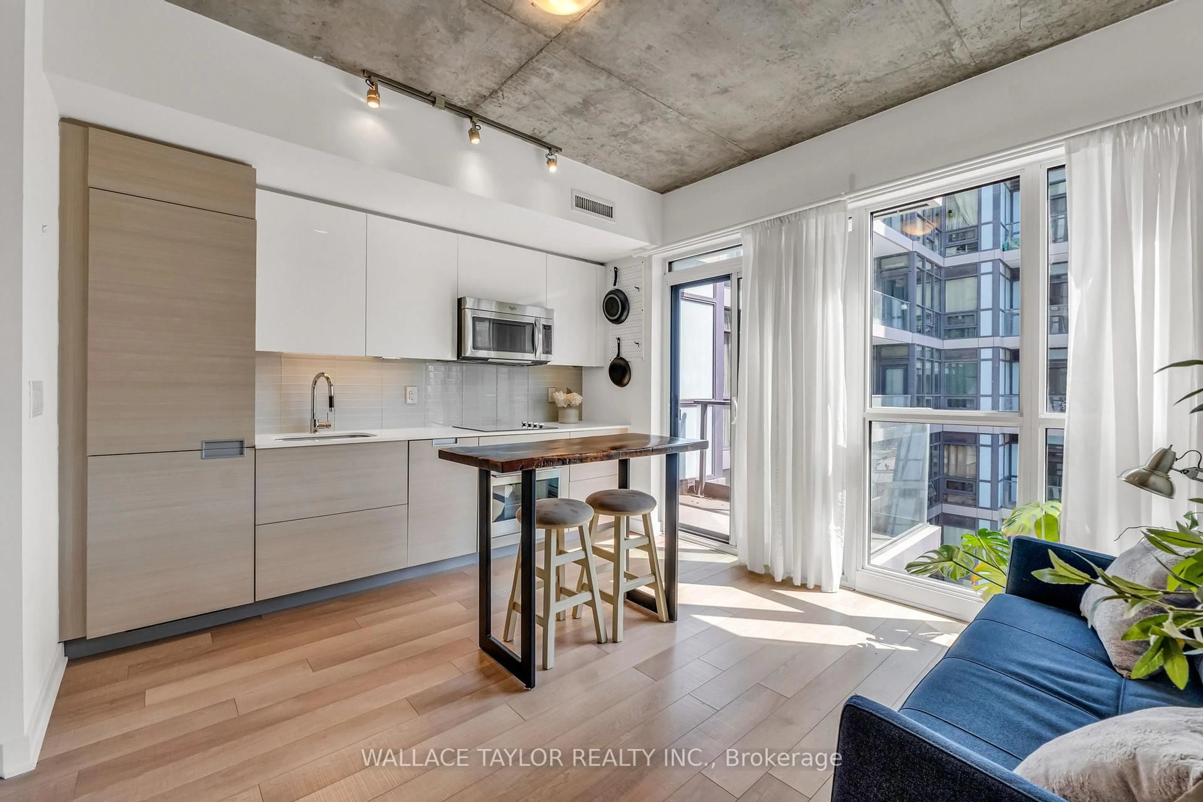 Open concept kitchen, cement floor for 210 Simcoe St #1702, Toronto Ontario M5T 0A9