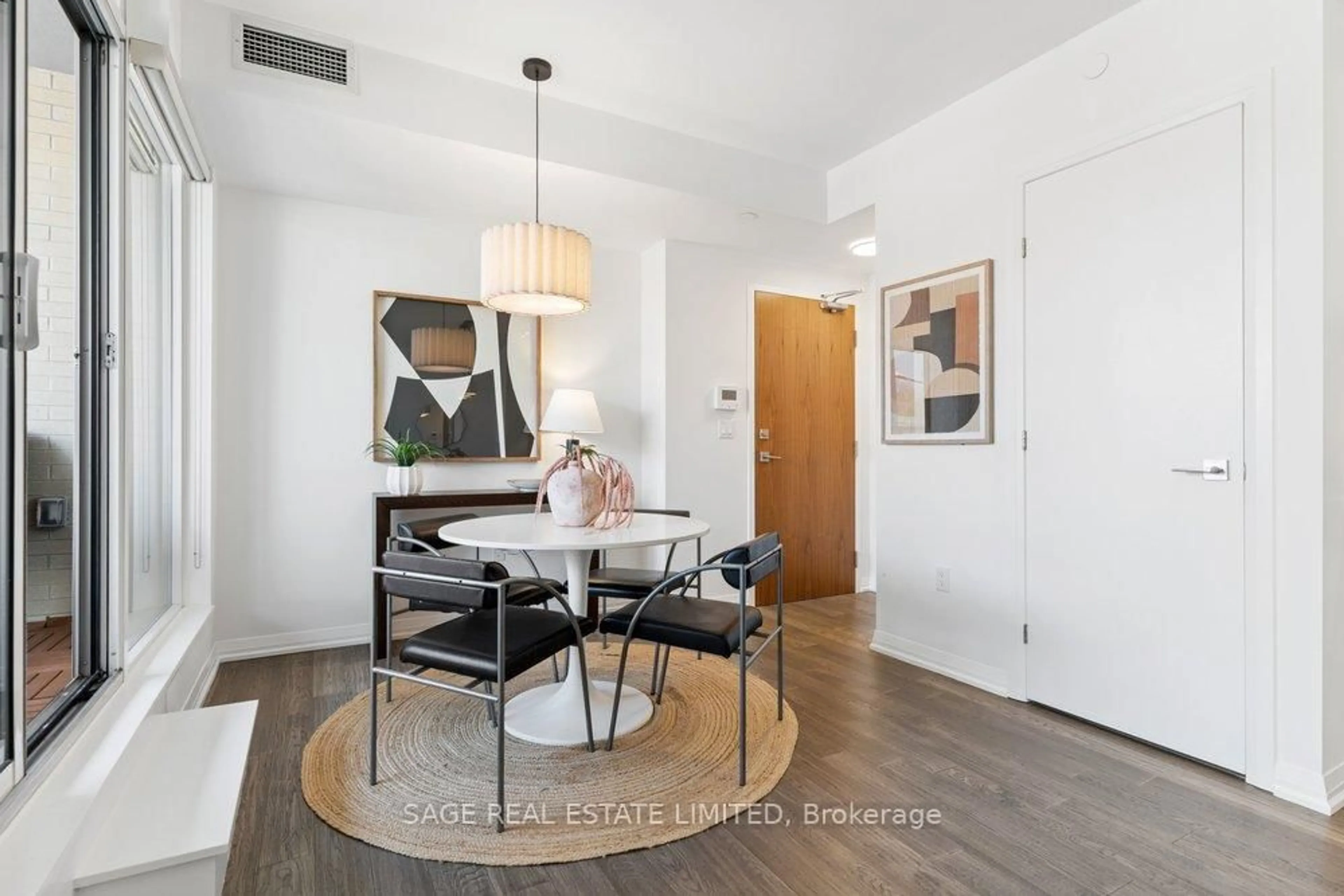 Dining room, wood/laminate floor for 835 St Clair Ave #207, Toronto Ontario M6C 0A8