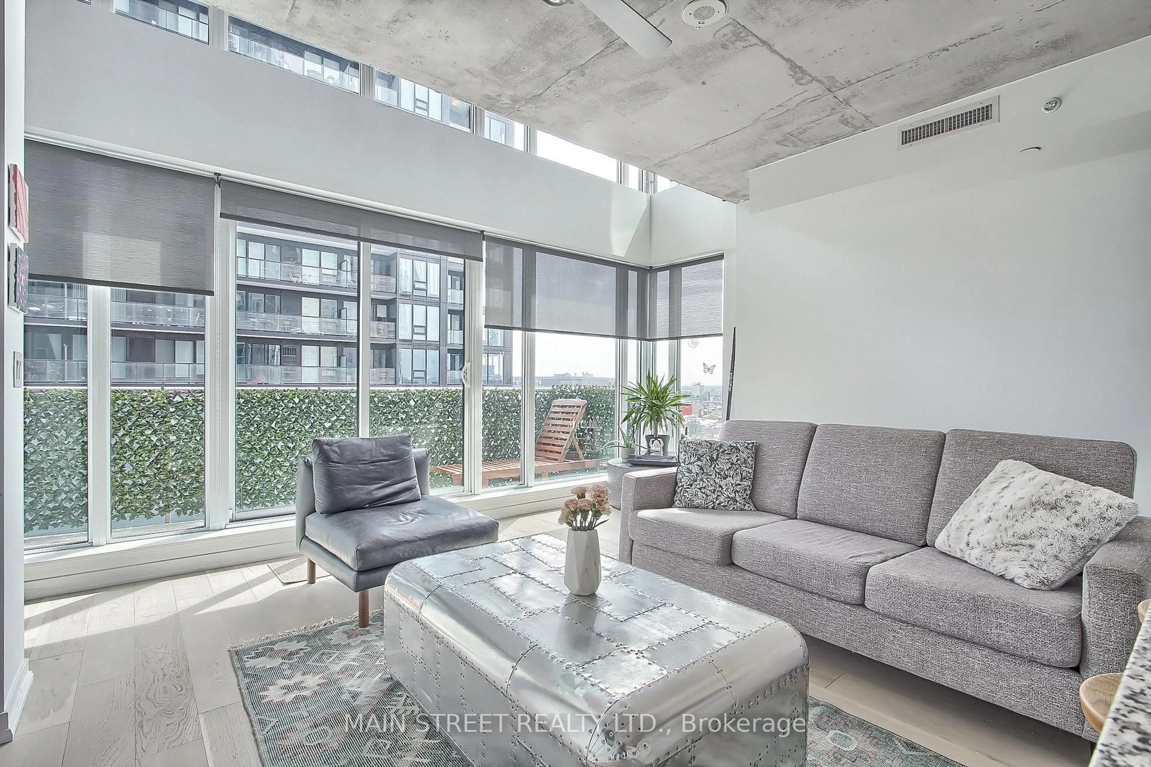 Living room with furniture, cement floor for 150 East Liberty St #1213, Toronto Ontario M6K 3R5