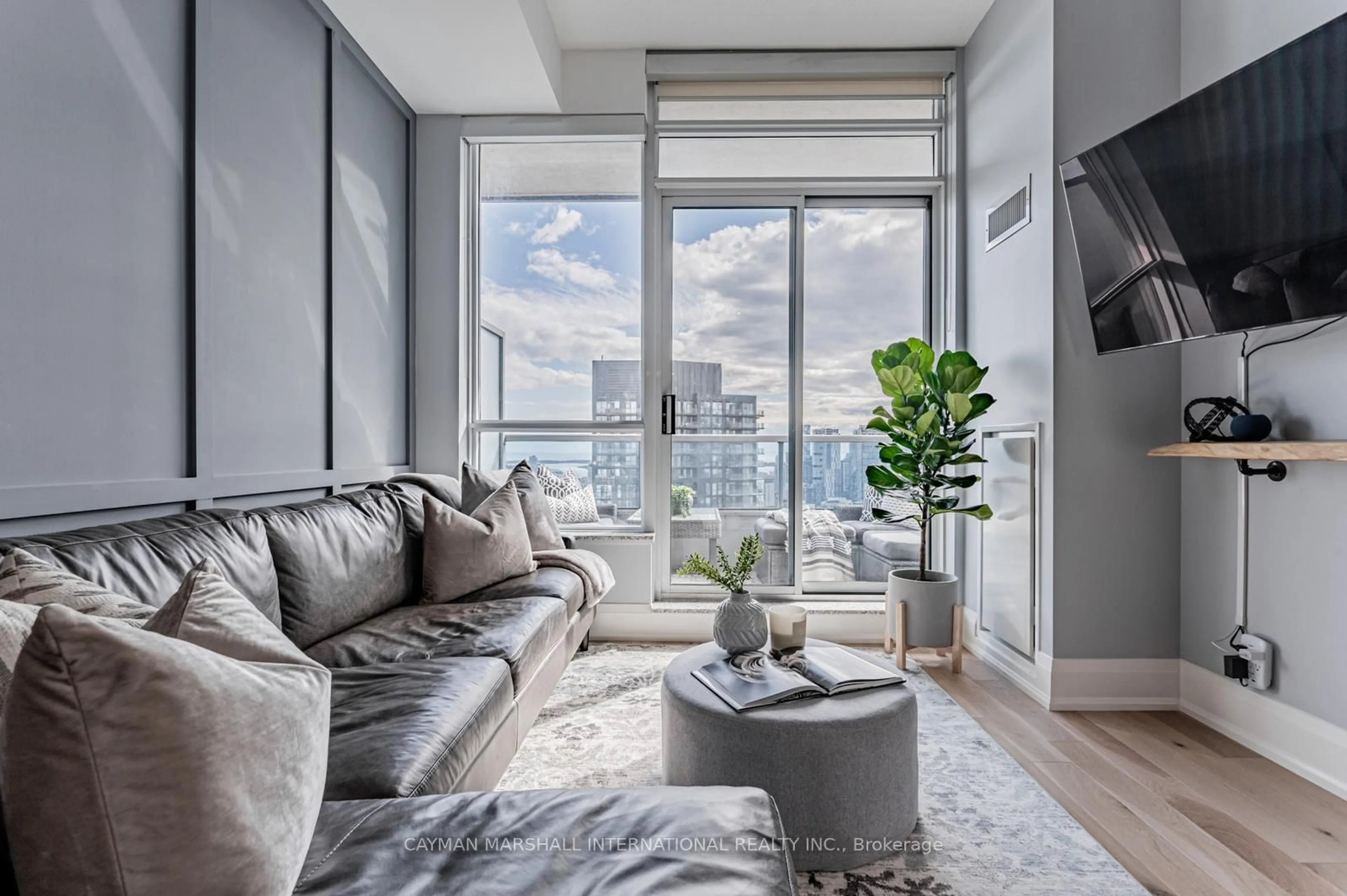 Living room with furniture, cement floor for 500 Sherbourne St #3205, Toronto Ontario M4X 1L1
