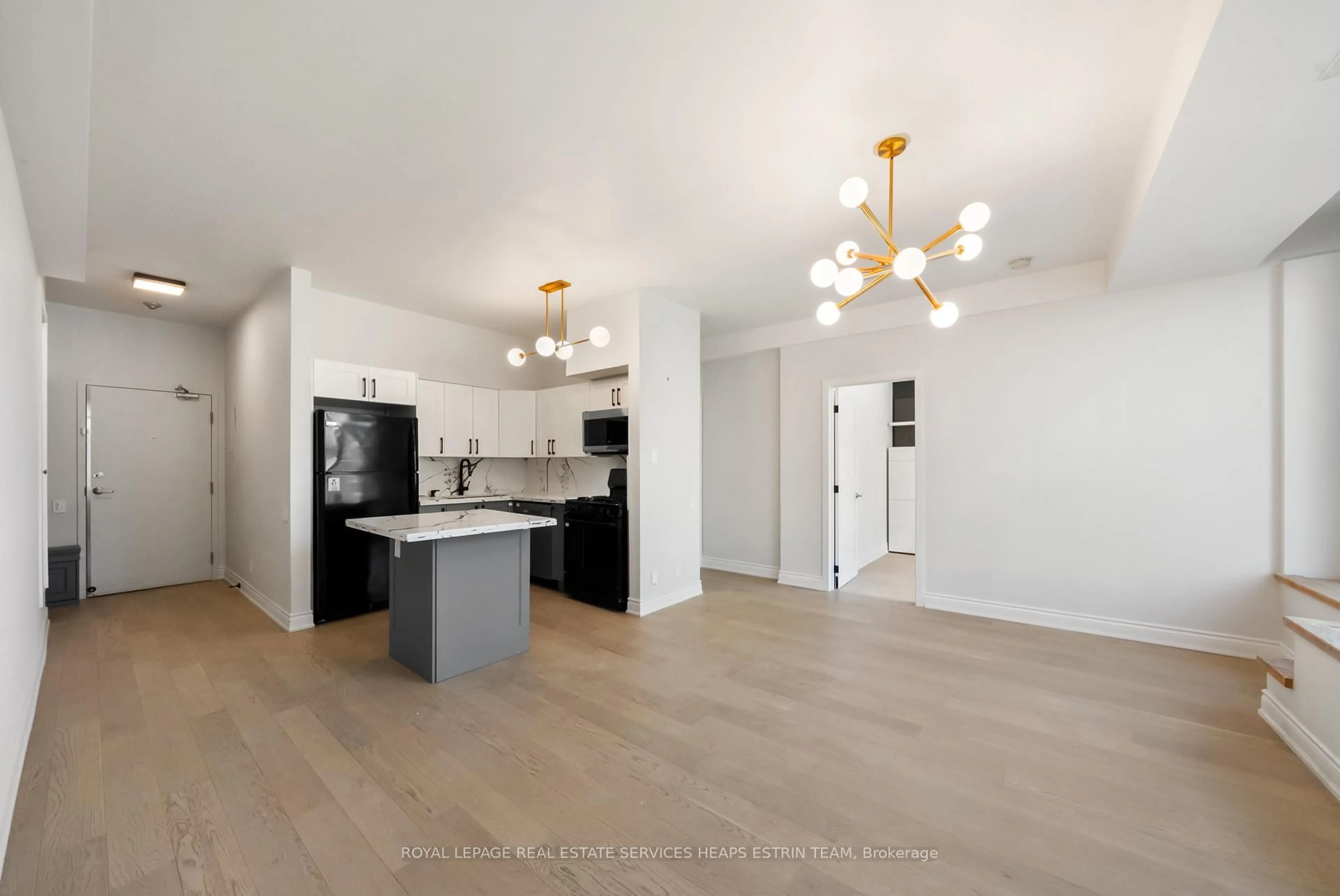 Open concept kitchen, wood/laminate floor for 50 Camden St #303, Toronto Ontario M5V 3N1