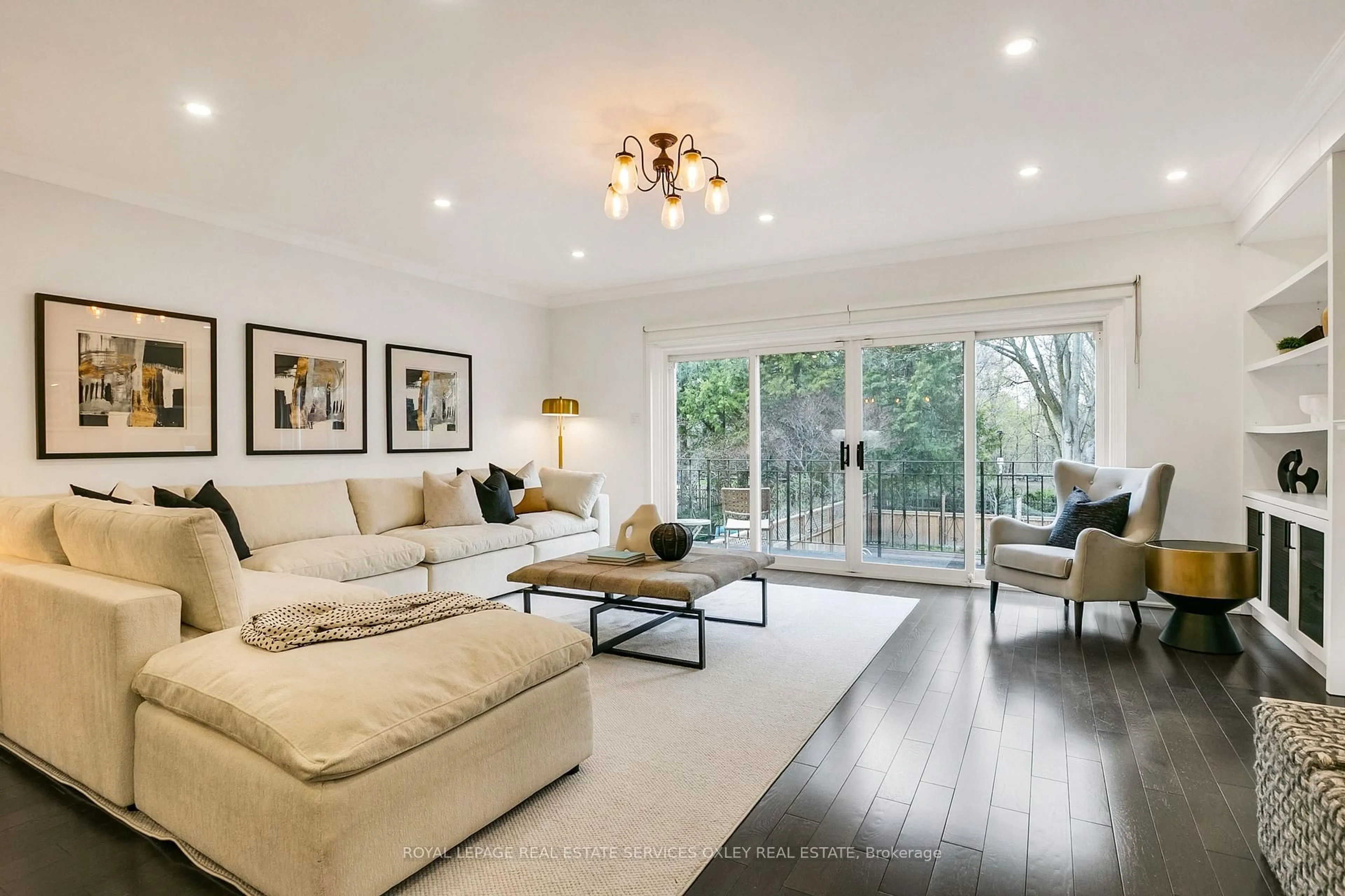Living room with furniture, wood/laminate floor for 102 Elm Ave, Toronto Ontario M4W 1P2
