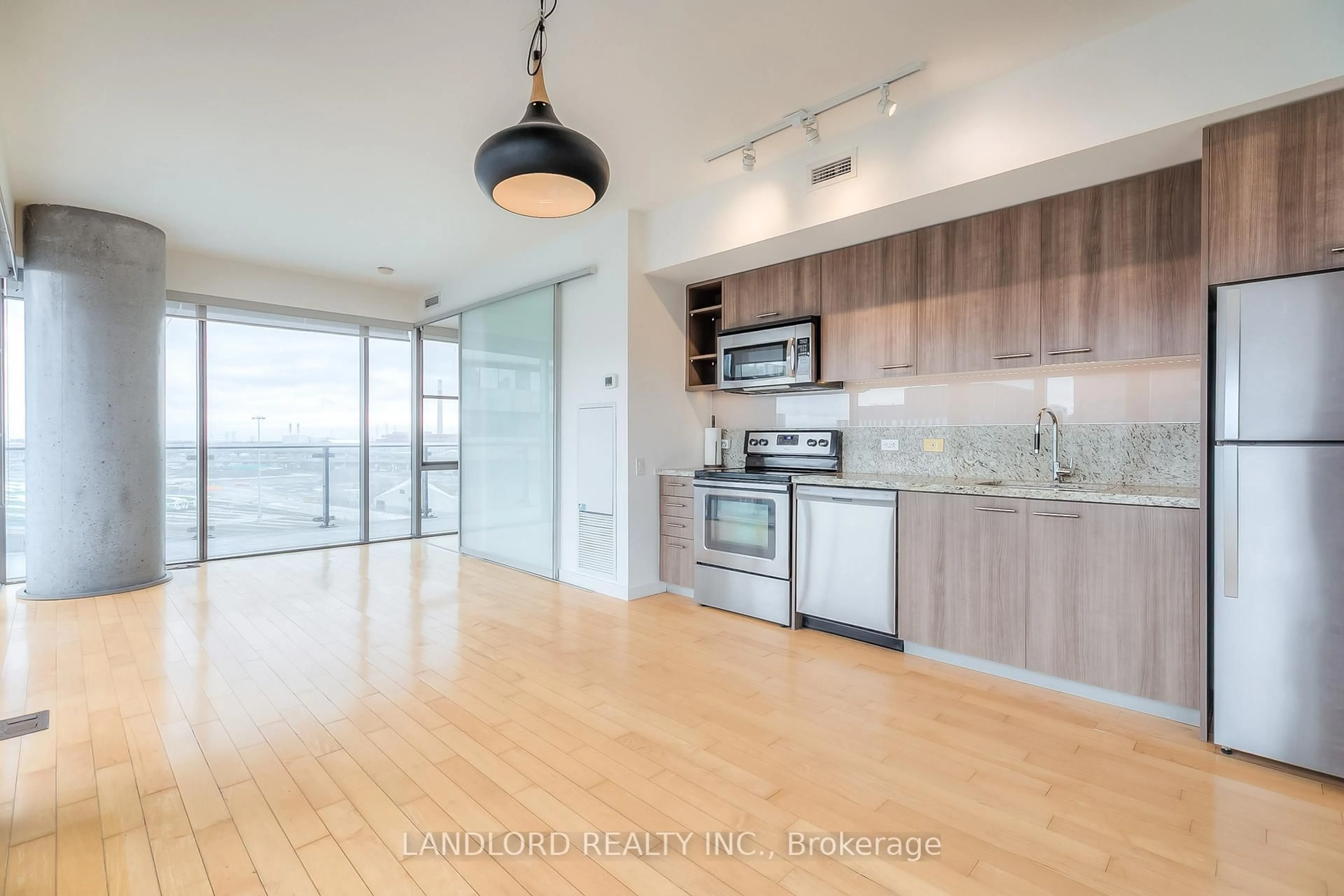 Open concept kitchen, wood/laminate floor for 70 Distillery Lane #903, Toronto Ontario M5A 0E3
