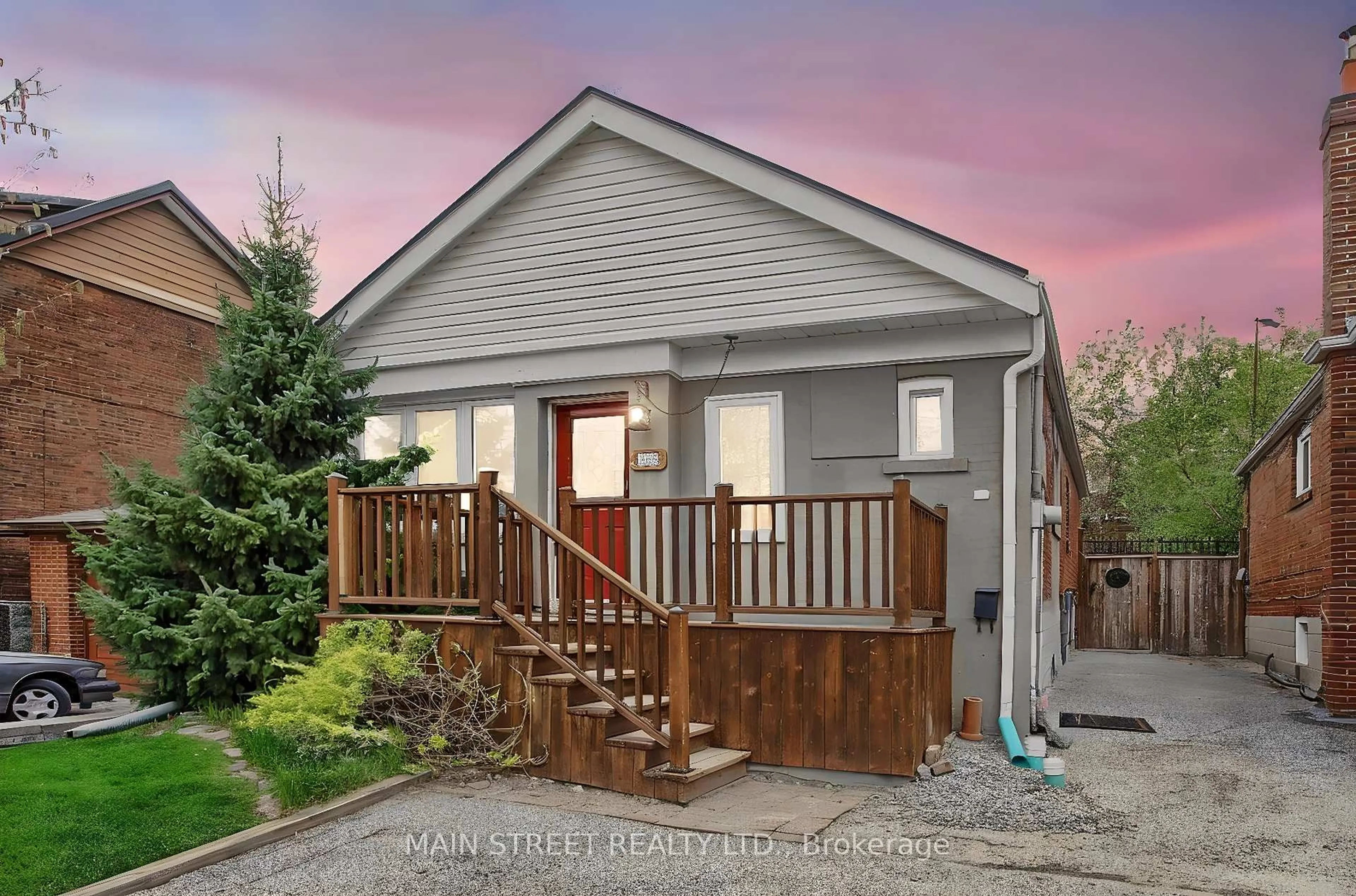 Home with vinyl exterior material, street for 595 Northcliffe Blvd, Toronto Ontario M6E 3L6