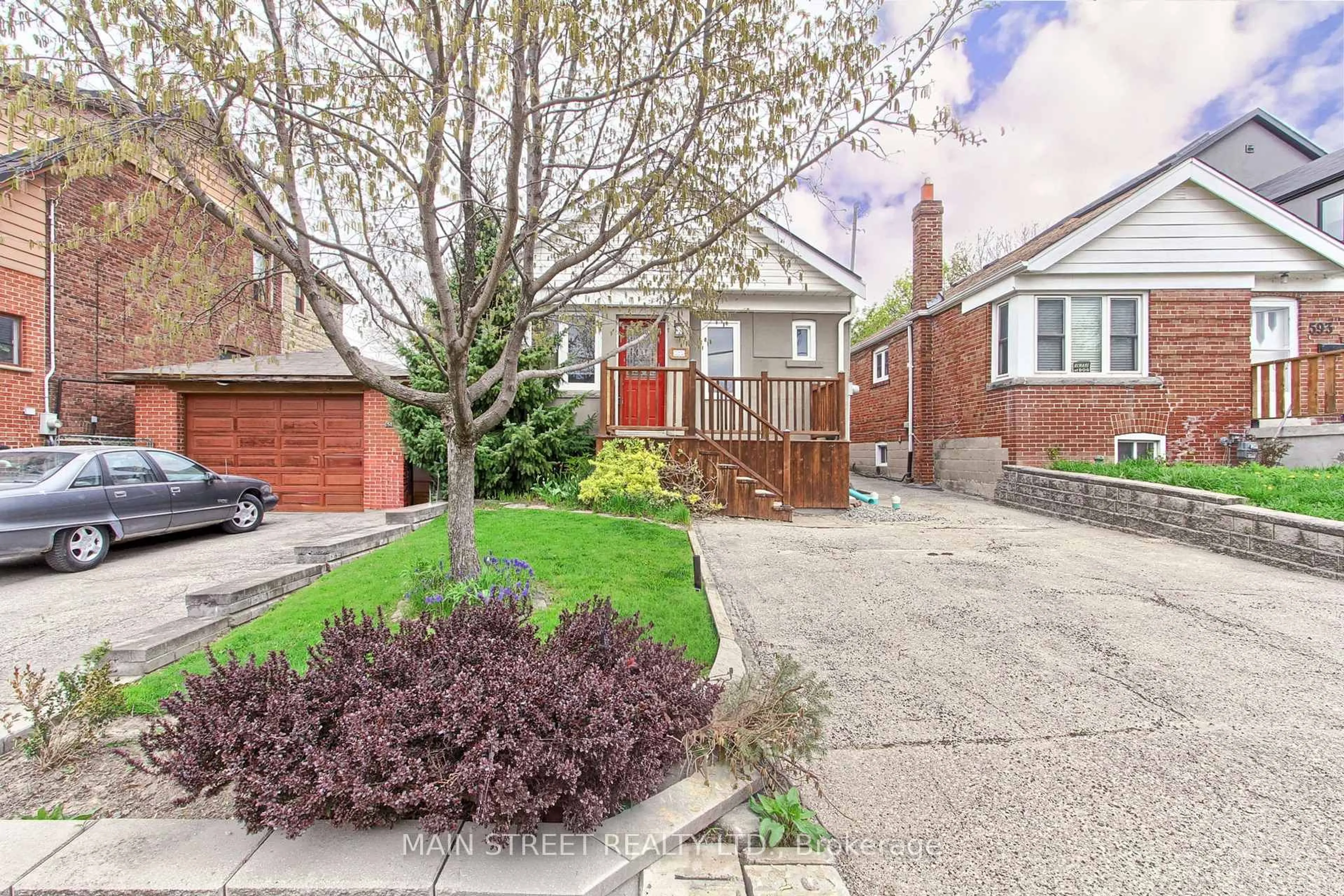 Home with brick exterior material, street for 595 Northcliffe Blvd, Toronto Ontario M6E 3L6