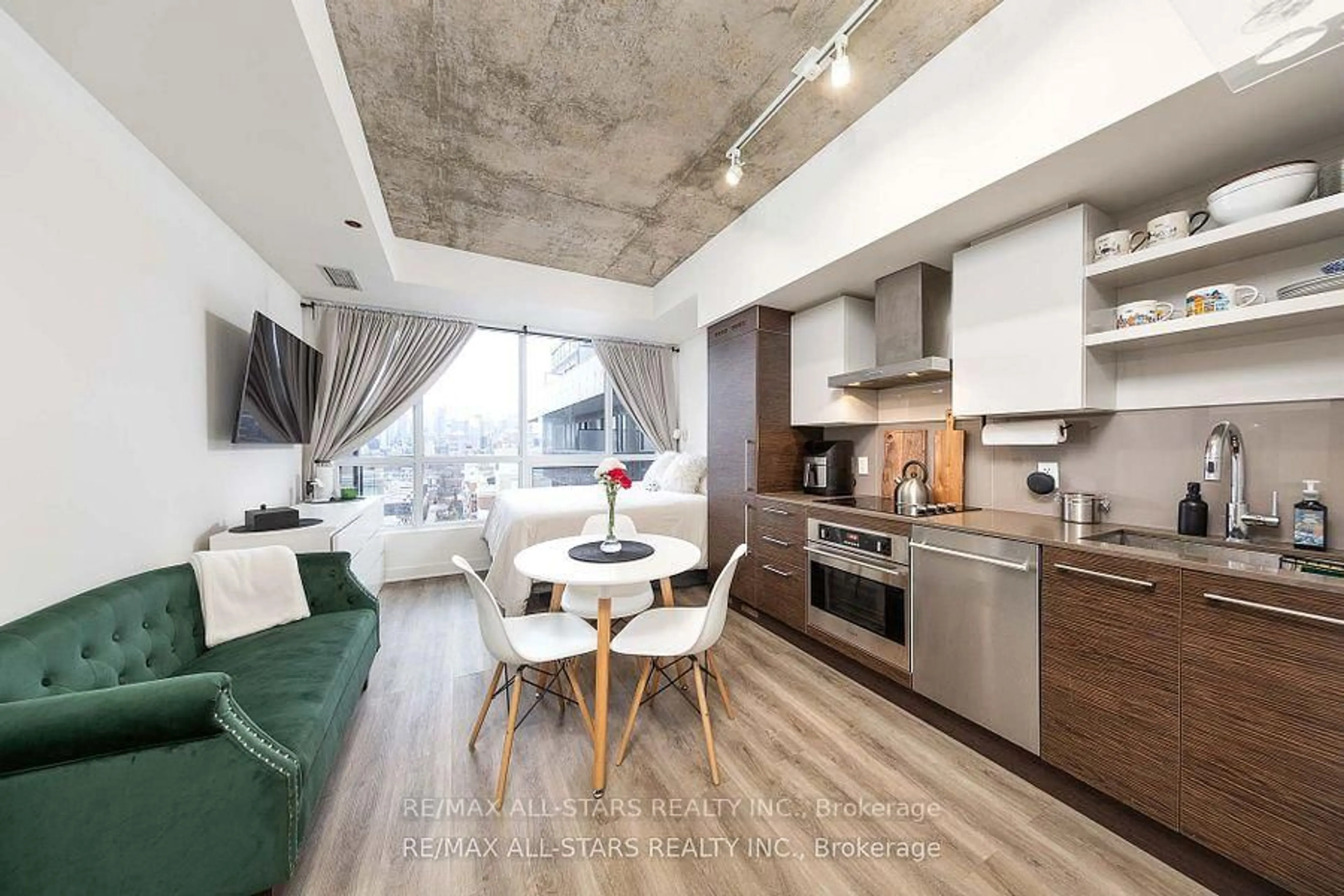 Open concept kitchen, cement floor for 1030 King St #908, Toronto Ontario M6K 0B4