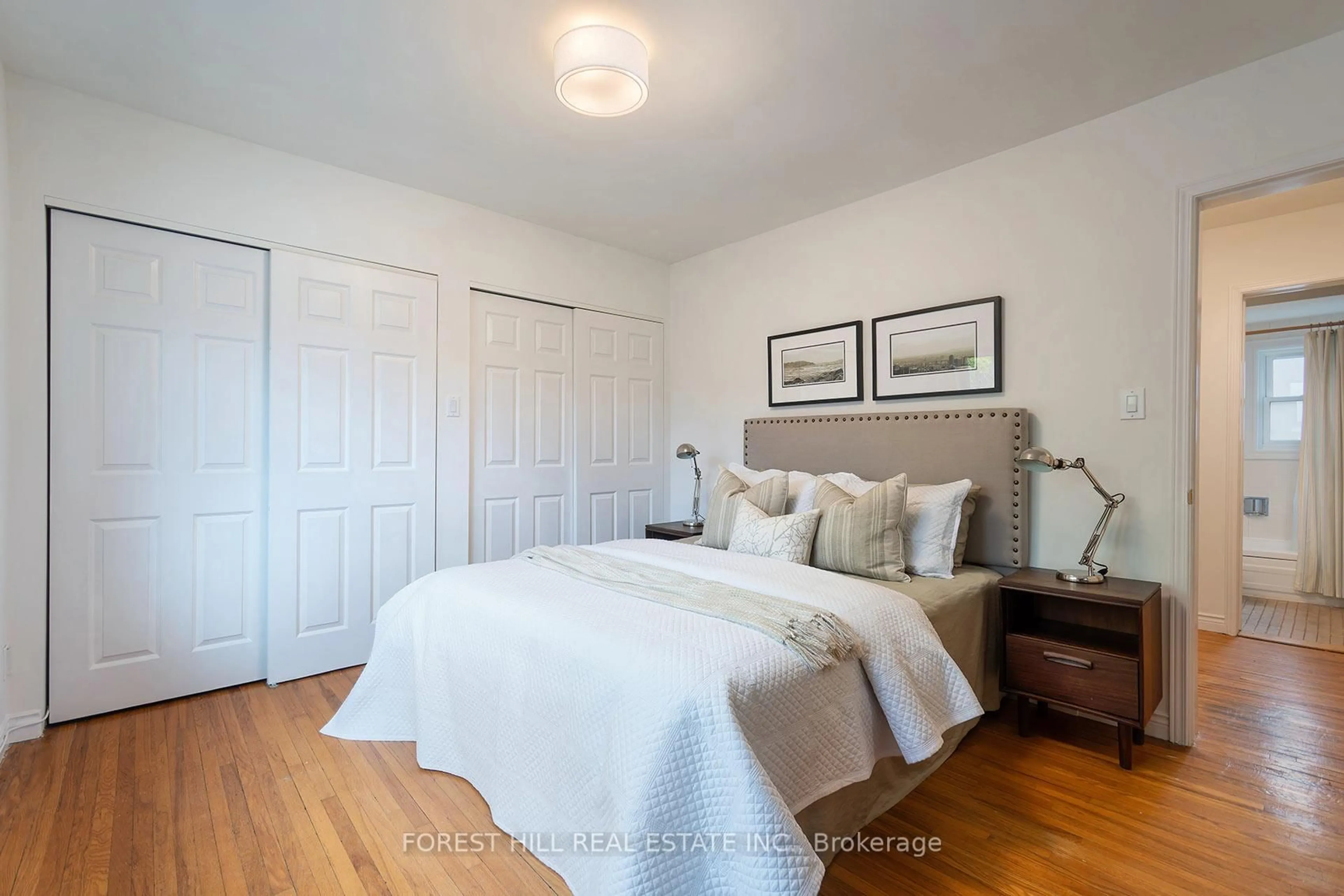 Bedroom with bed, wood/laminate floor for 7 Cleveland St, Toronto Ontario M4S 2V9