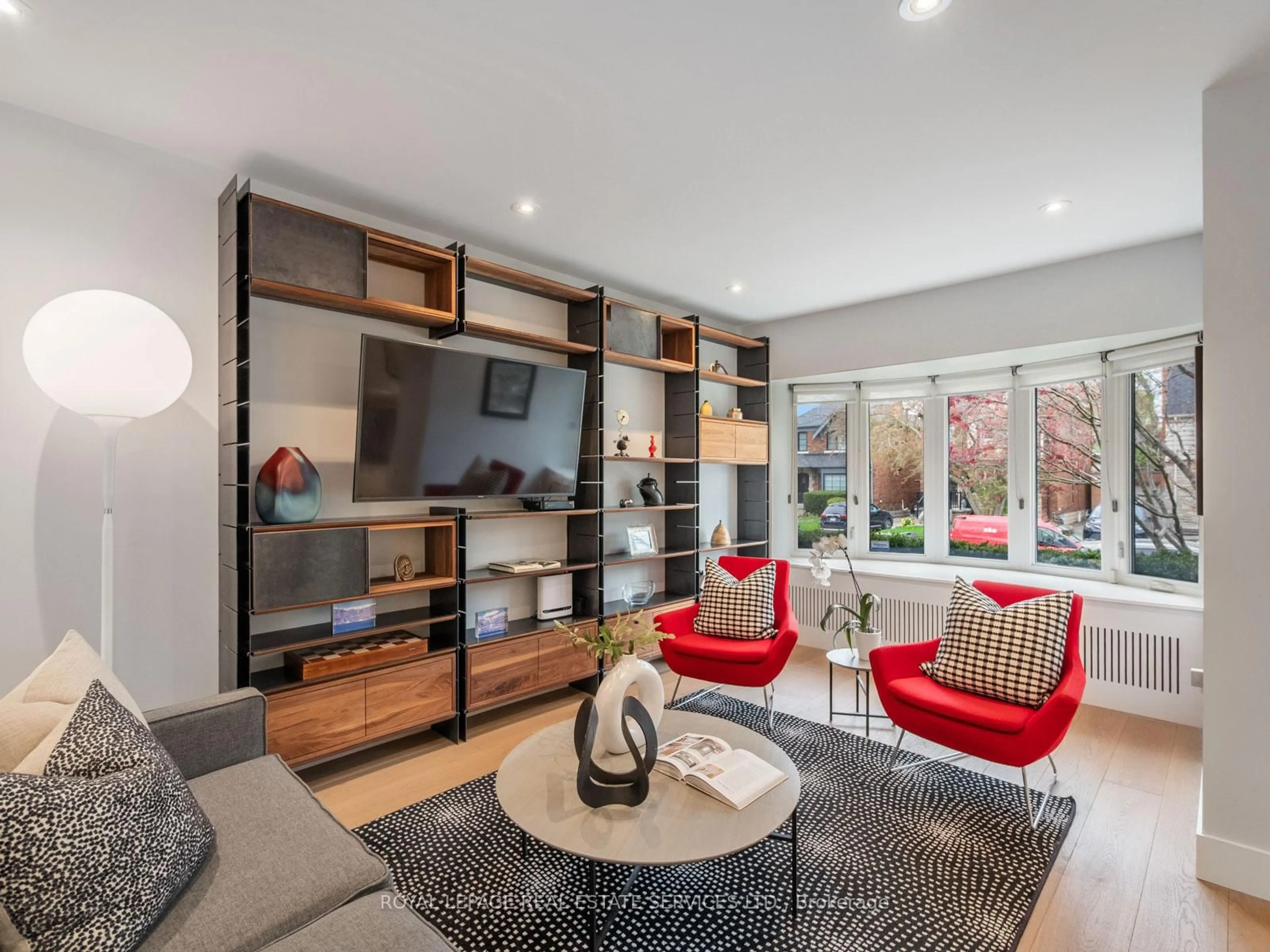 Living room with furniture, wood/laminate floor for 185 Glen Cedar Rd, Toronto Ontario M6C 3G9