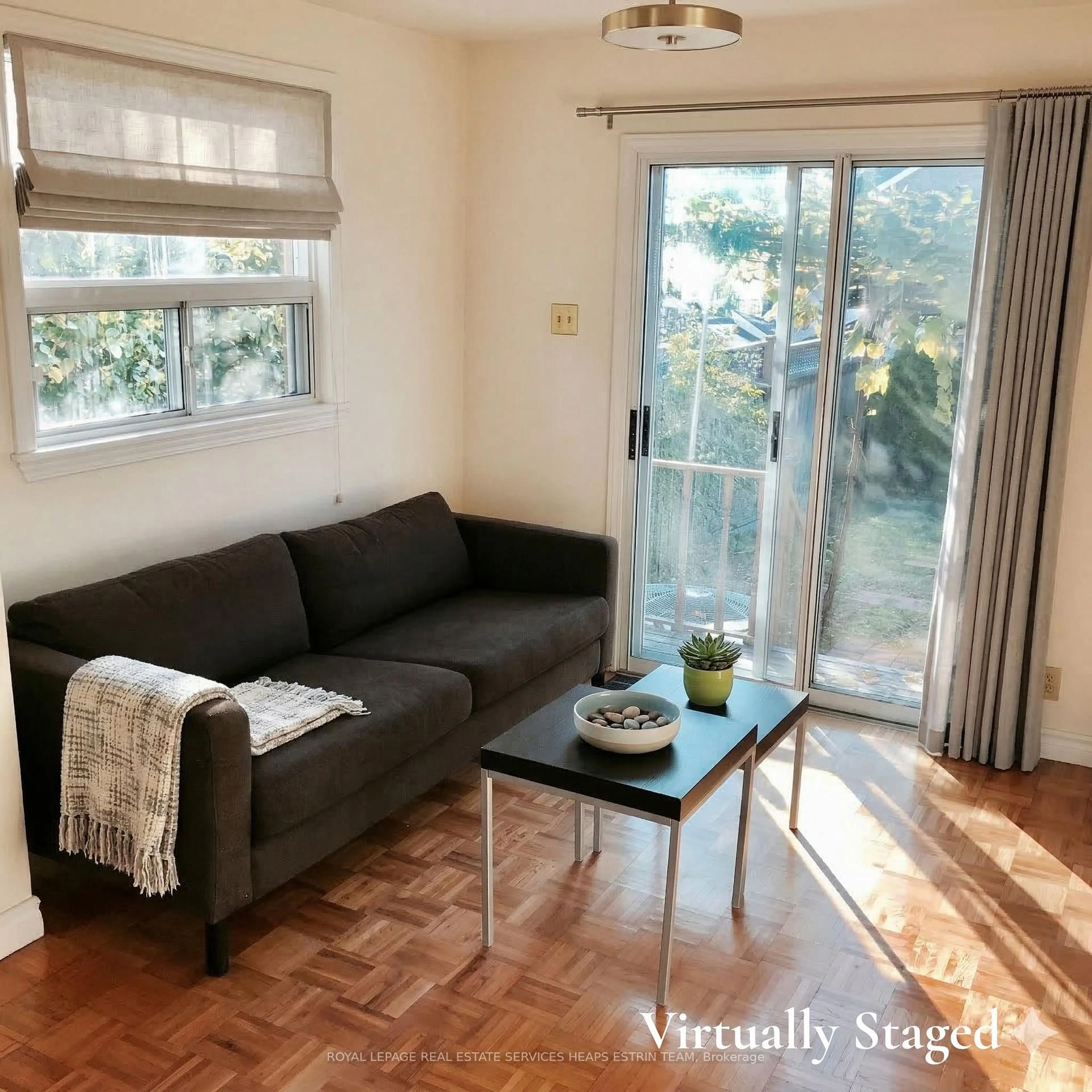 Living room with furniture, wood/laminate floor for 11 Foxley St, Toronto Ontario M6J 1P9