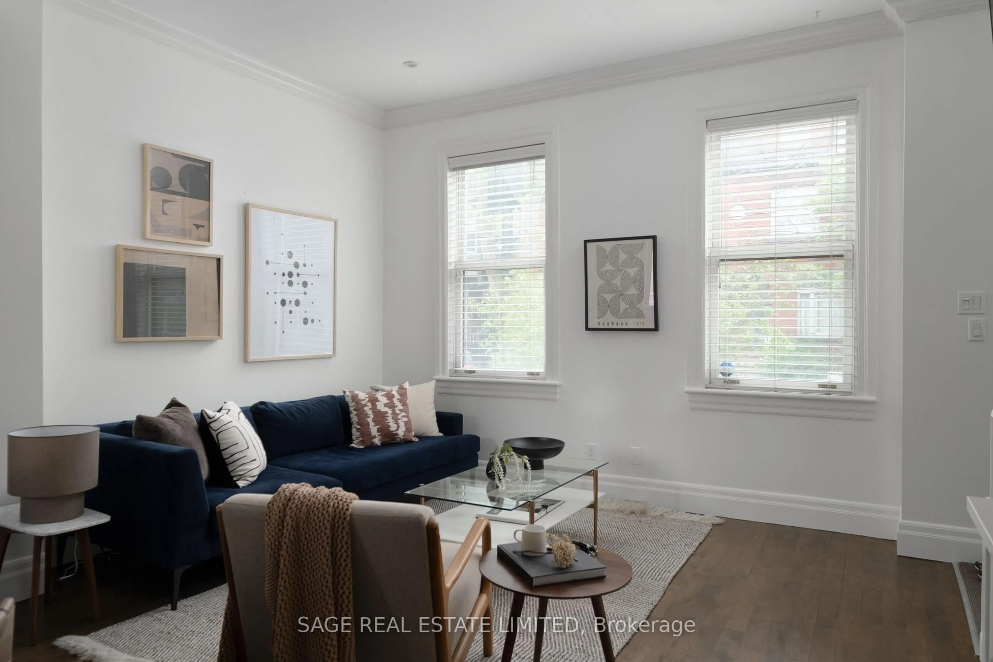 Living room with furniture, wood/laminate floor for 438 Sumach St, Toronto Ontario M4X 1V7