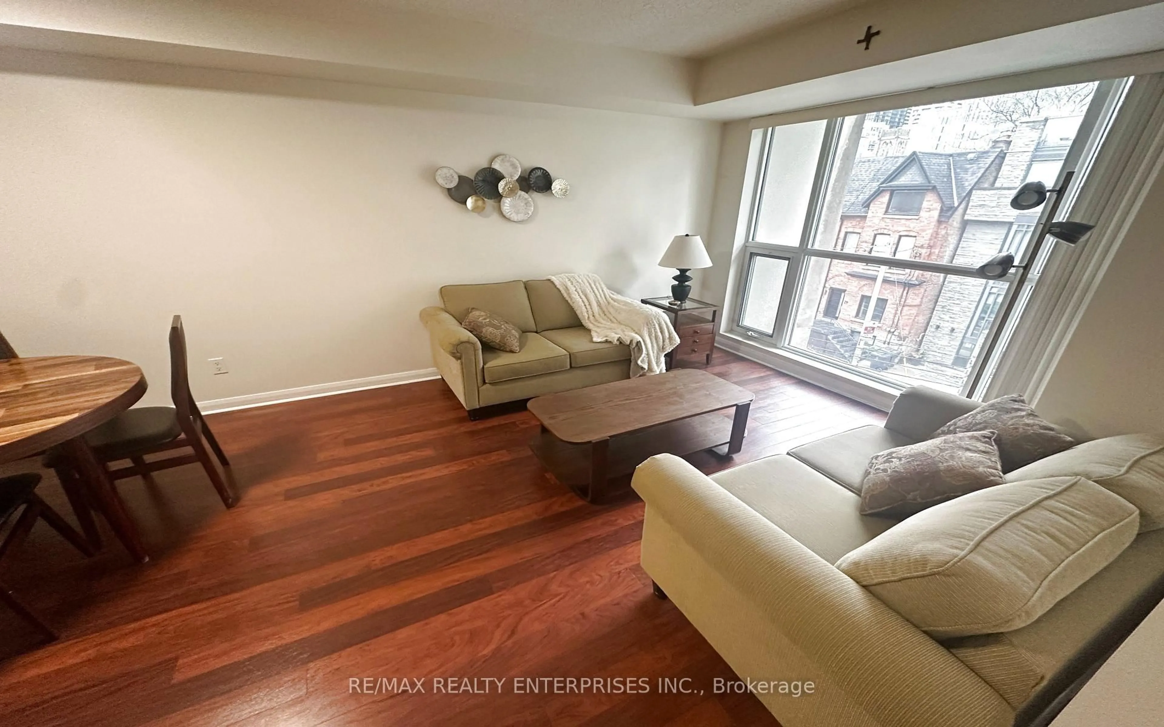 Living room with furniture, wood/laminate floor for 18 Beverley St #412, Toronto Ontario M5T 3L2
