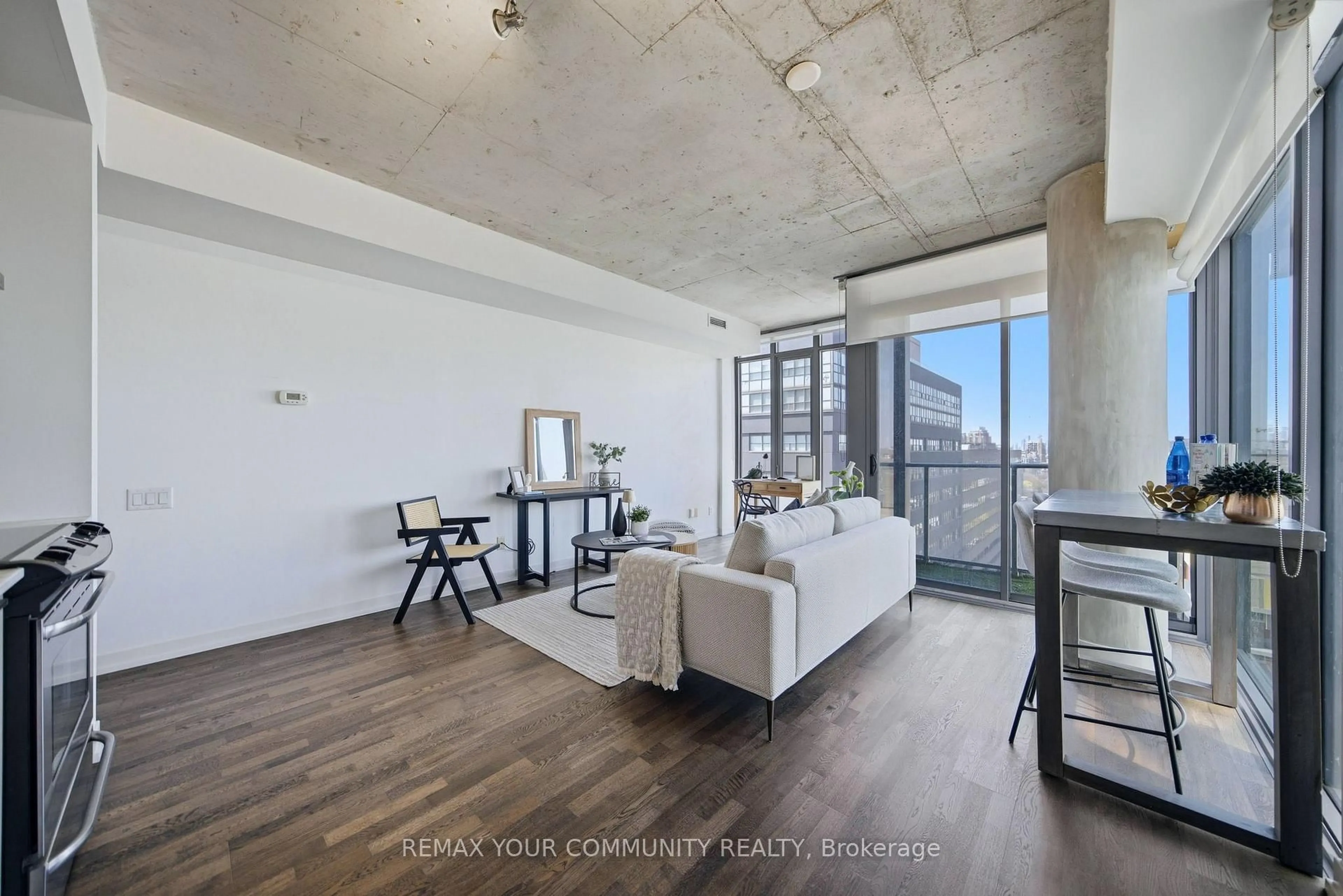 Living room with furniture, cement floor for 95 Bathurst St #1307, Toronto Ontario M5V 0H7