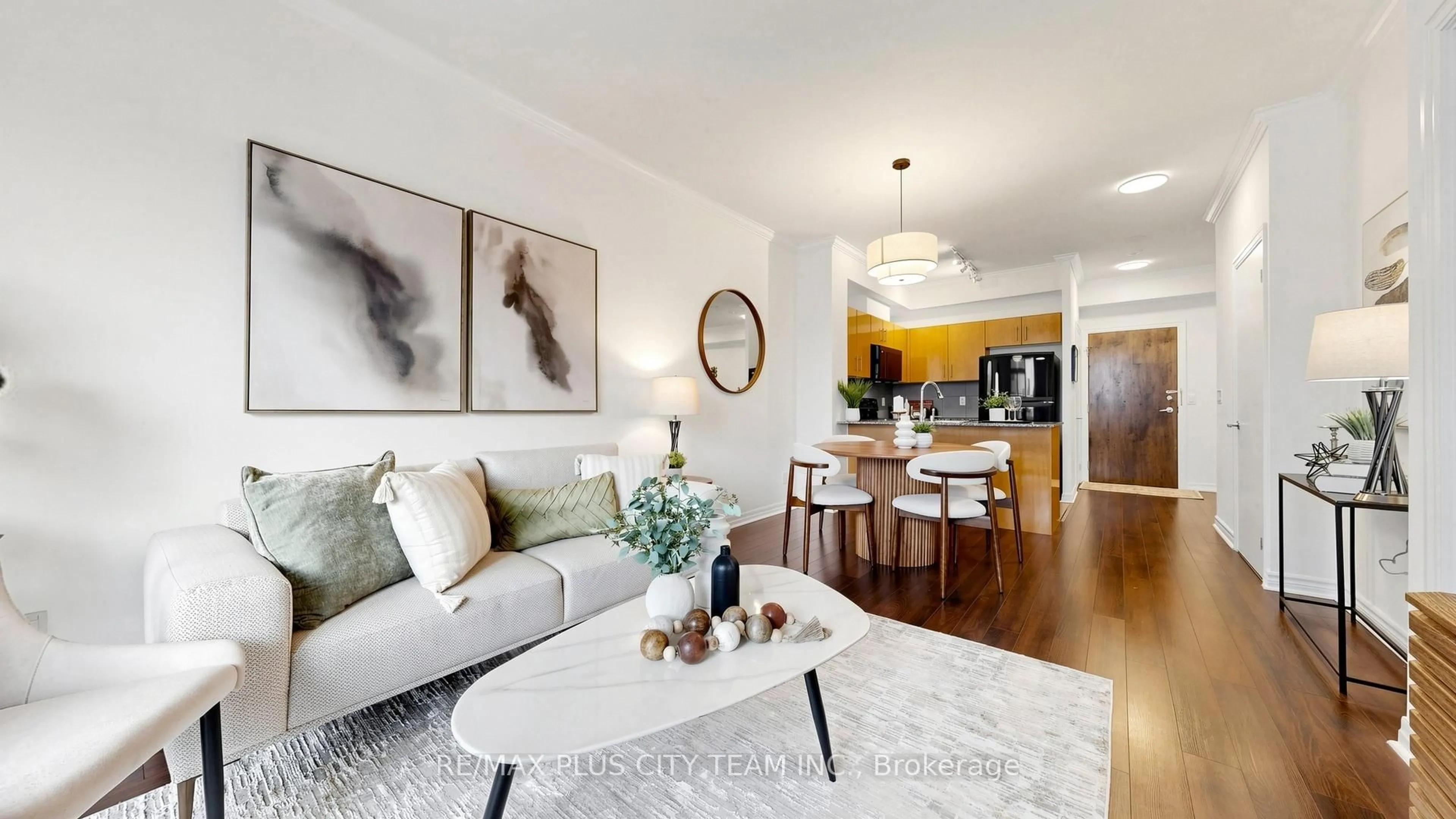 Living room with furniture, wood/laminate floor for 16 Yonge St #303, Toronto Ontario M5E 2A1