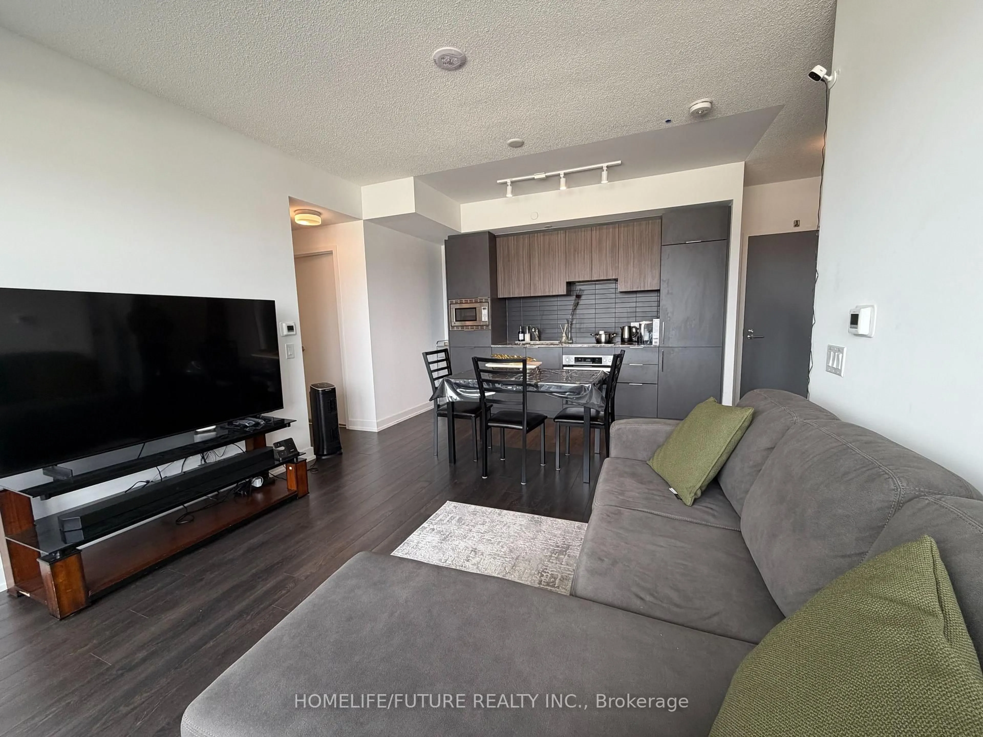 Living room with furniture, unknown for 50 O'Neill Rd #311, Toronto Ontario M3C 0R1