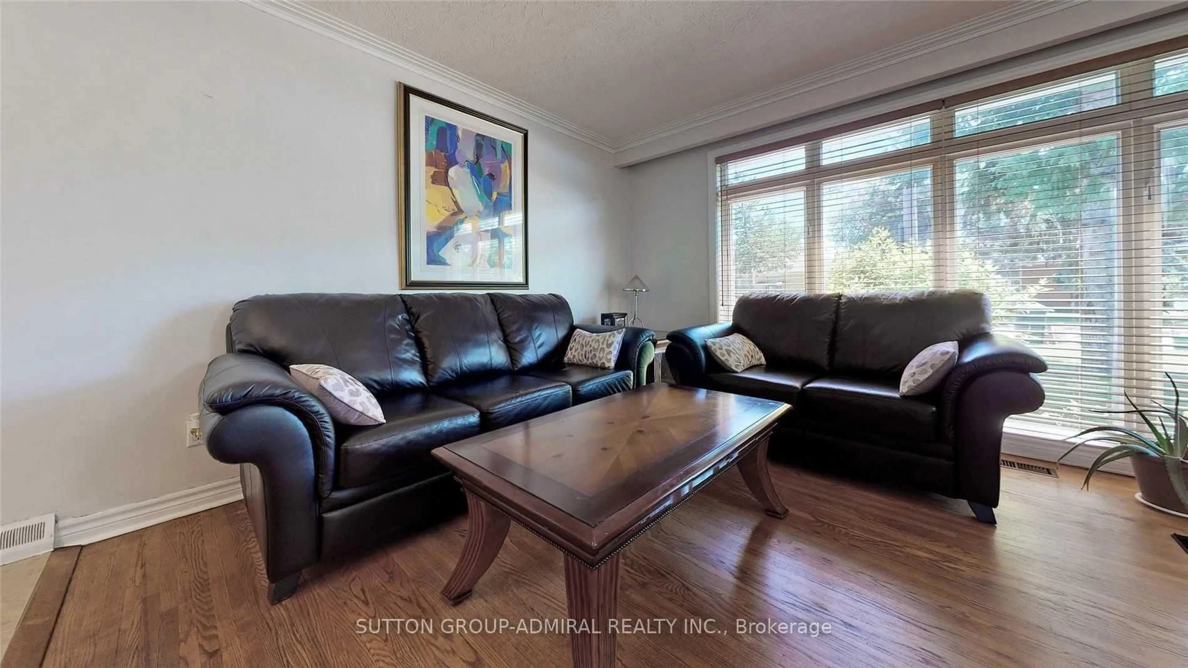 Living room with furniture, wood/laminate floor for 182 Reiner Rd, Toronto Ontario M3H 2L9