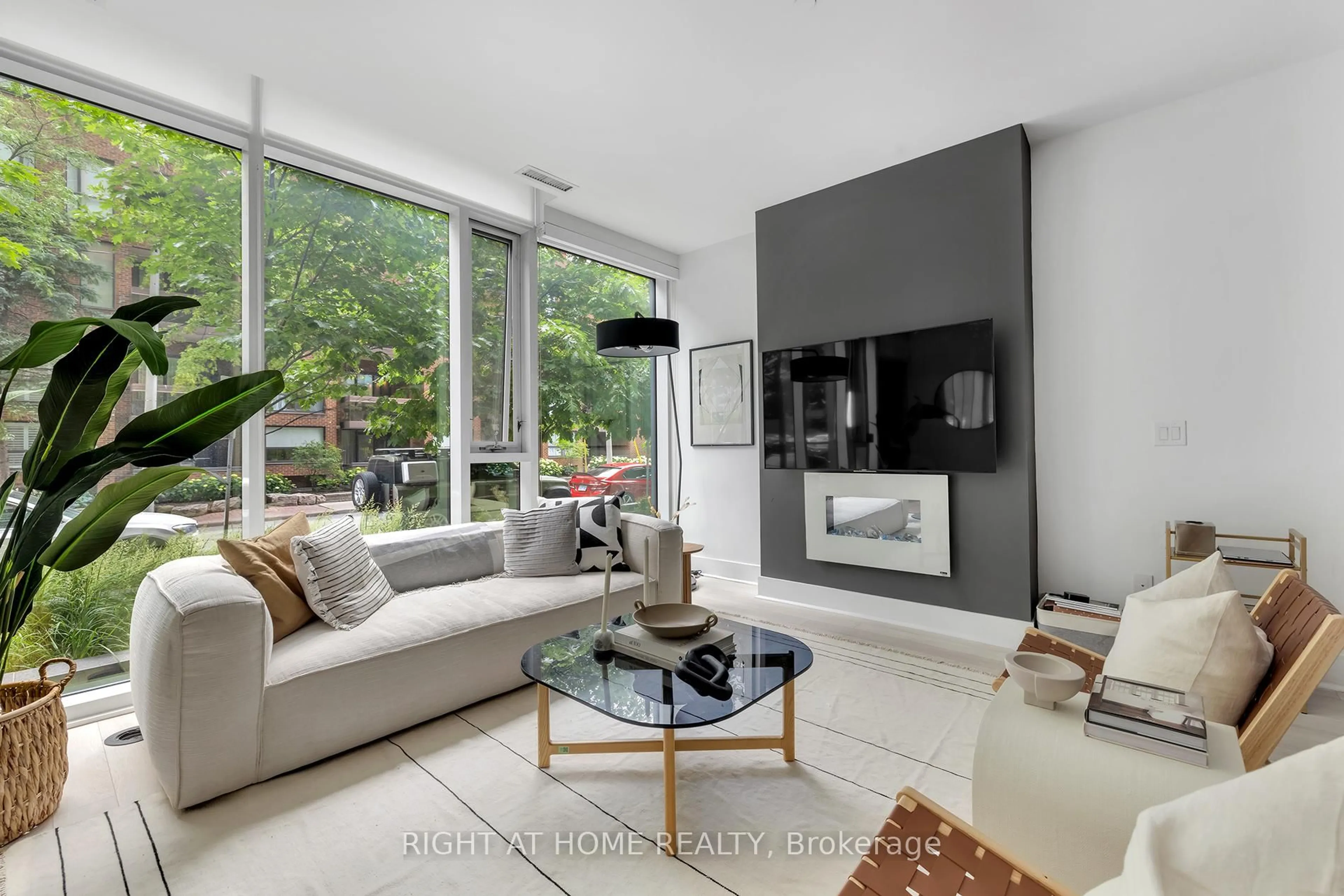 Living room with furniture, unknown for 32 Davenport Rd #TH 101, Toronto Ontario M5R 1H3