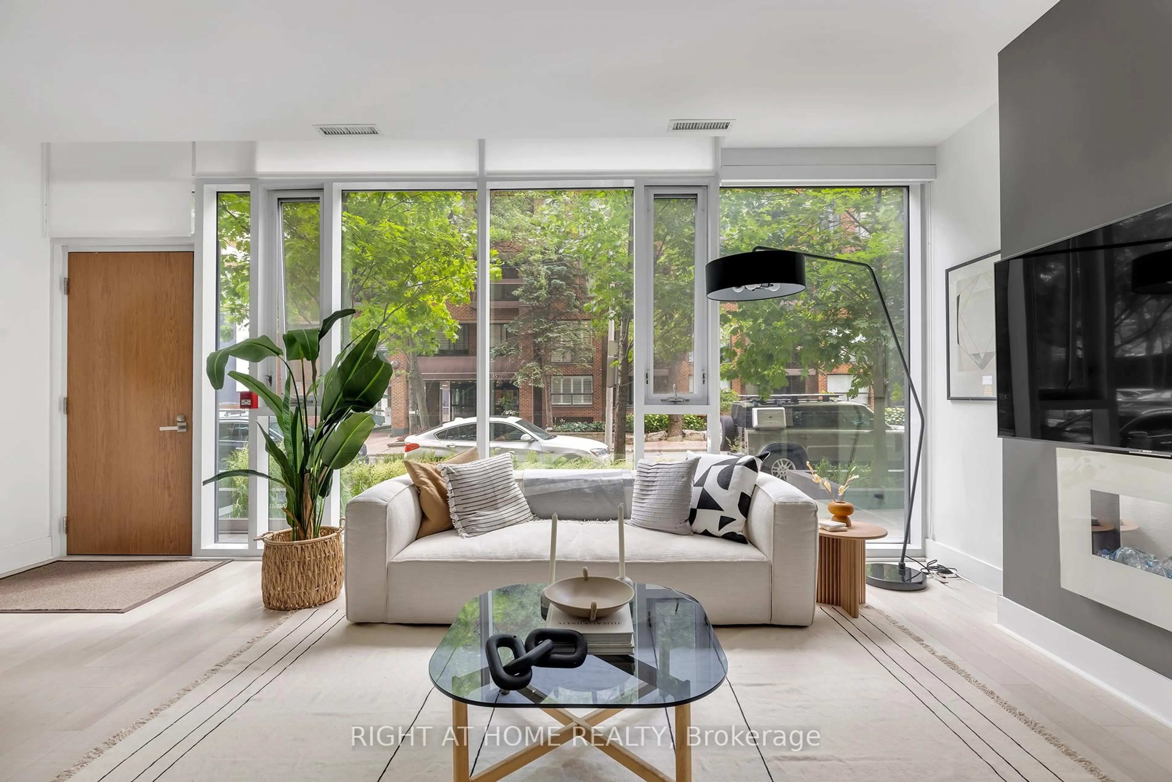 Living room with furniture, unknown for 32 Davenport Rd #TH 101, Toronto Ontario M5R 1H3