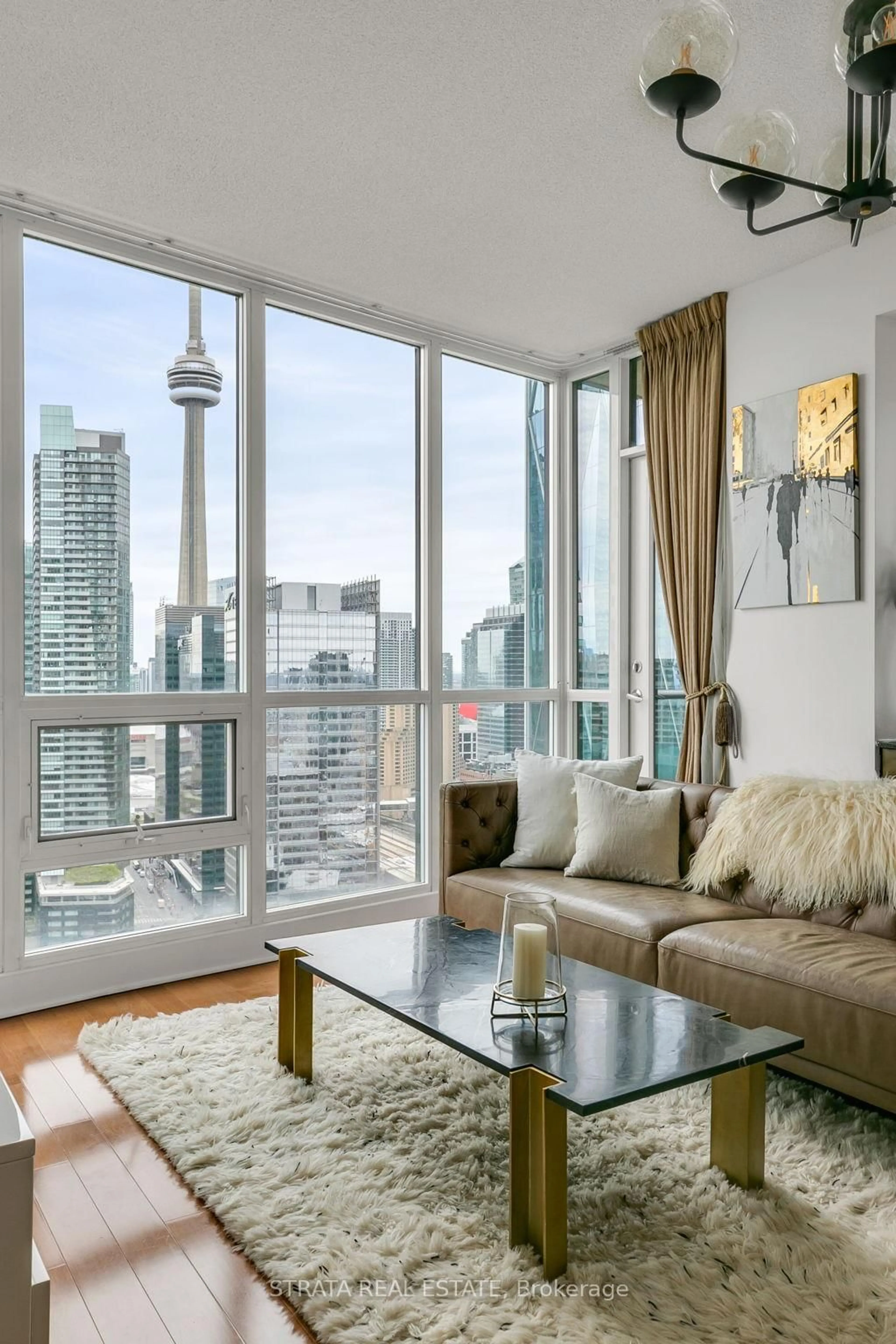 Living room with furniture, wood/laminate floor for 16 Yonge St #3602, Toronto Ontario M5E 2A1