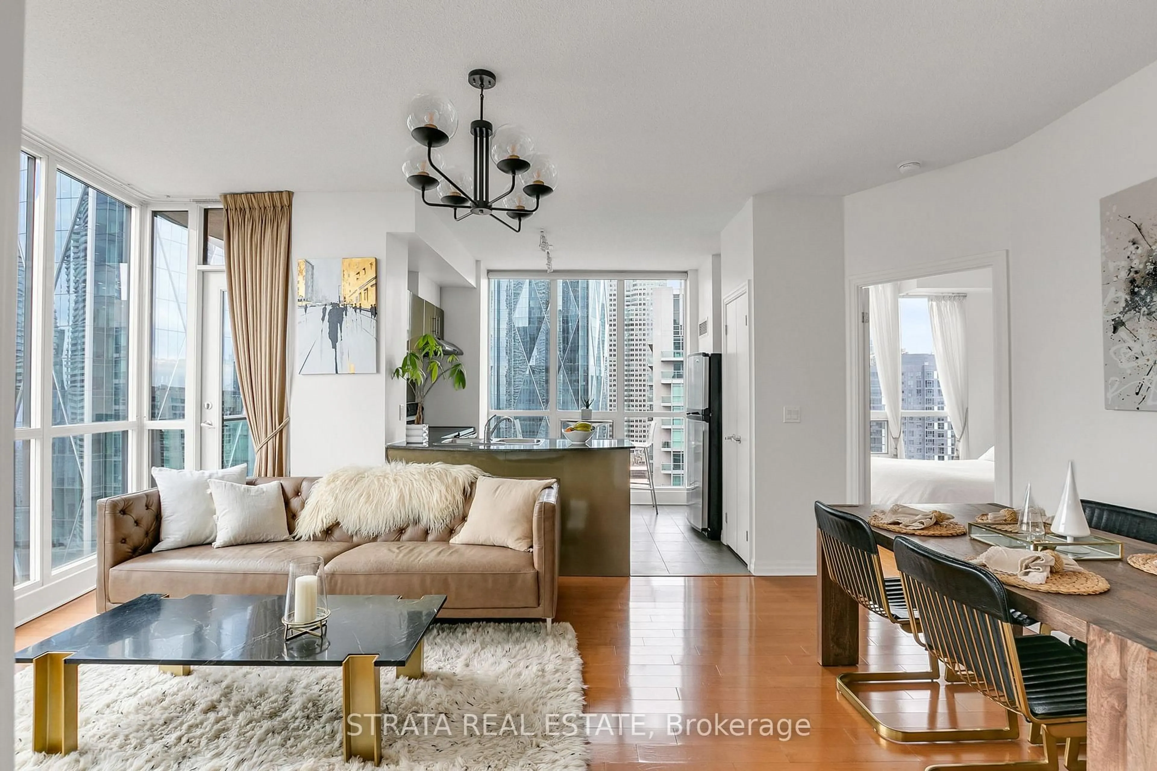 Living room with furniture, wood/laminate floor for 16 Yonge St #3602, Toronto Ontario M5E 2A1