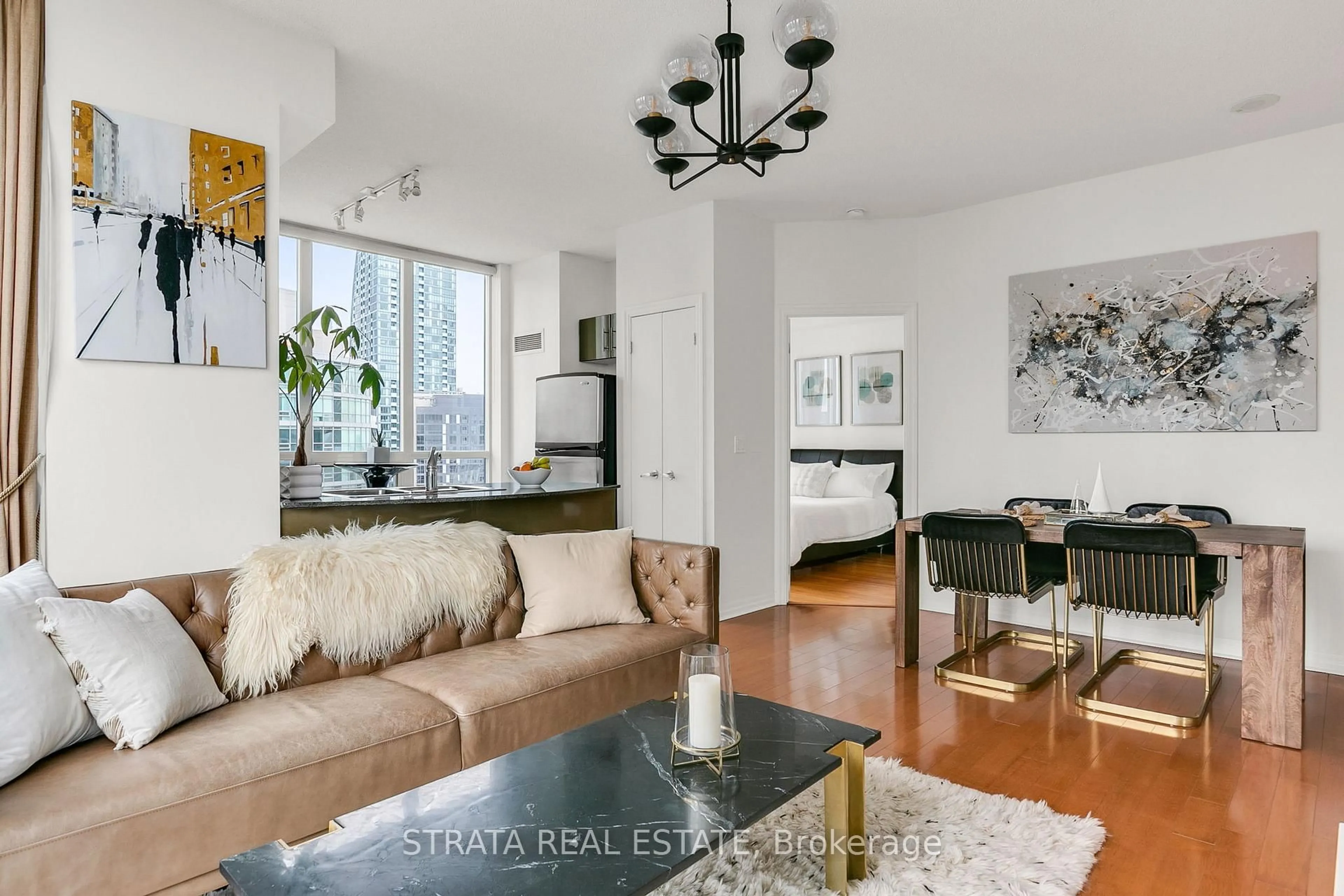 Living room with furniture, wood/laminate floor for 16 Yonge St #3602, Toronto Ontario M5E 2A1