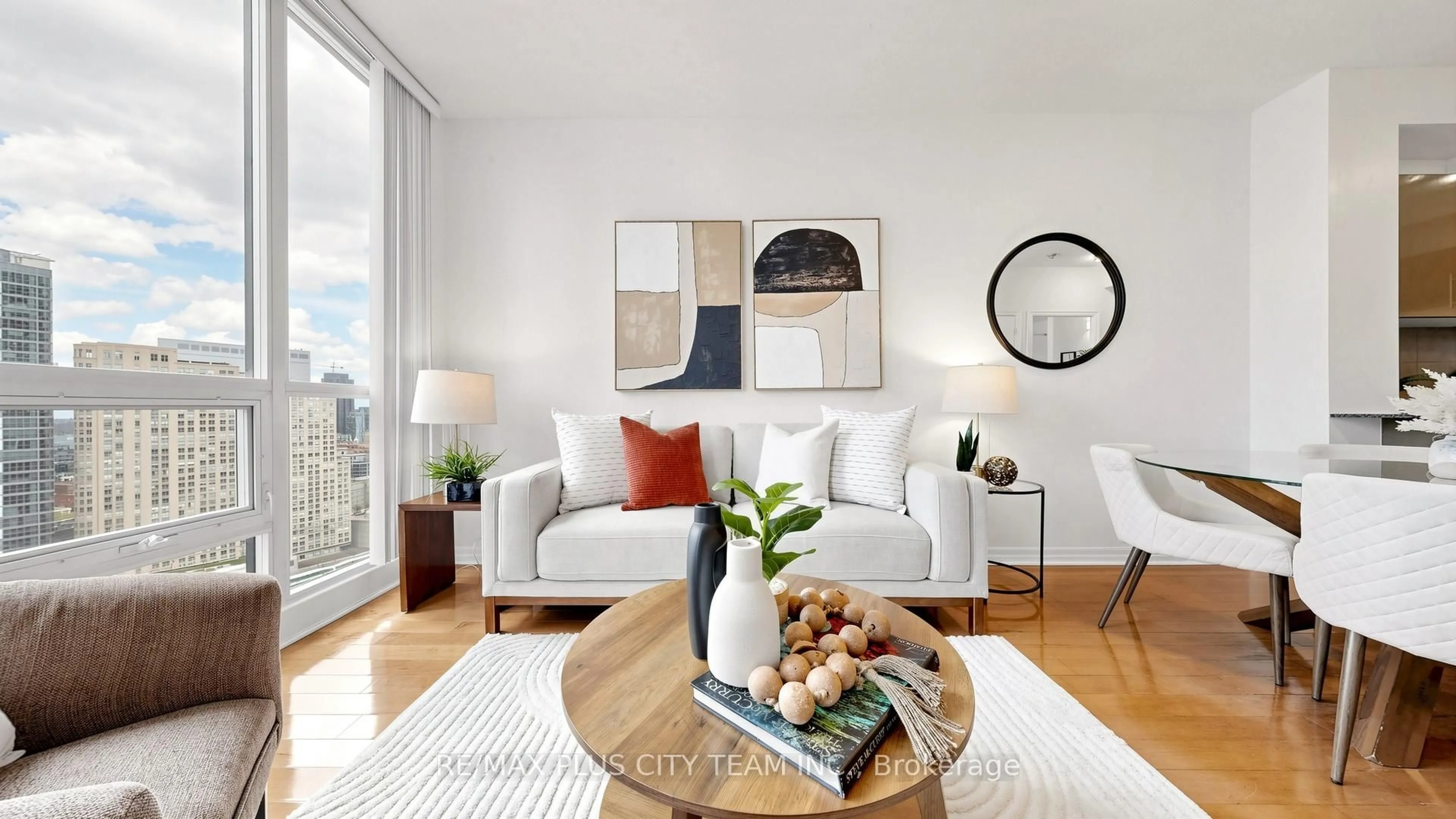 Living room with furniture, wood/laminate floor for 16 Yonge St #2604, Toronto Ontario M5E 2A1