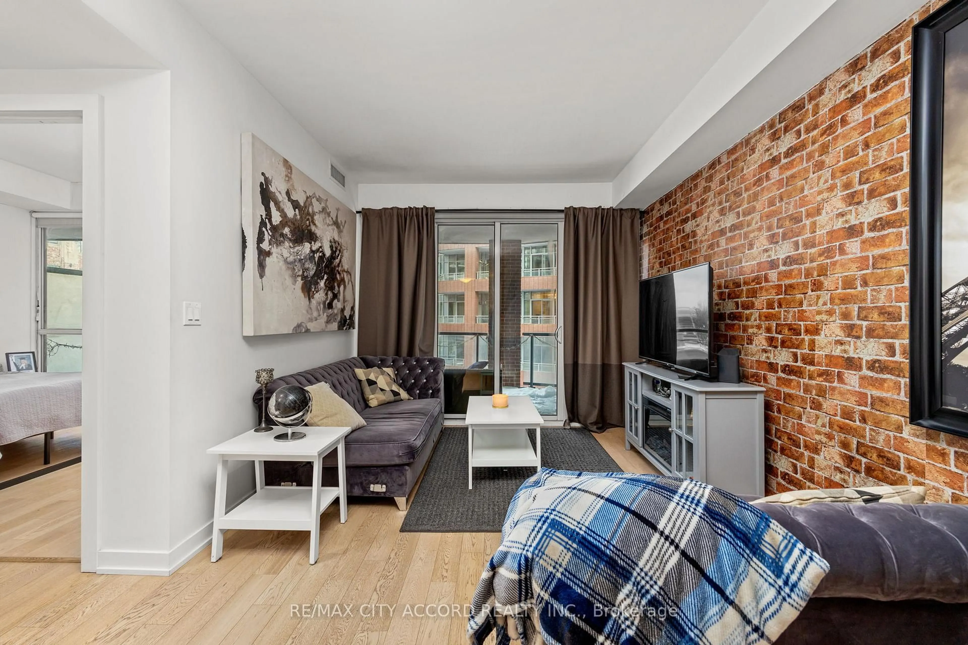 Living room with furniture, unknown for 20 Bruyeres Mews #311, Toronto Ontario M5V 0G8