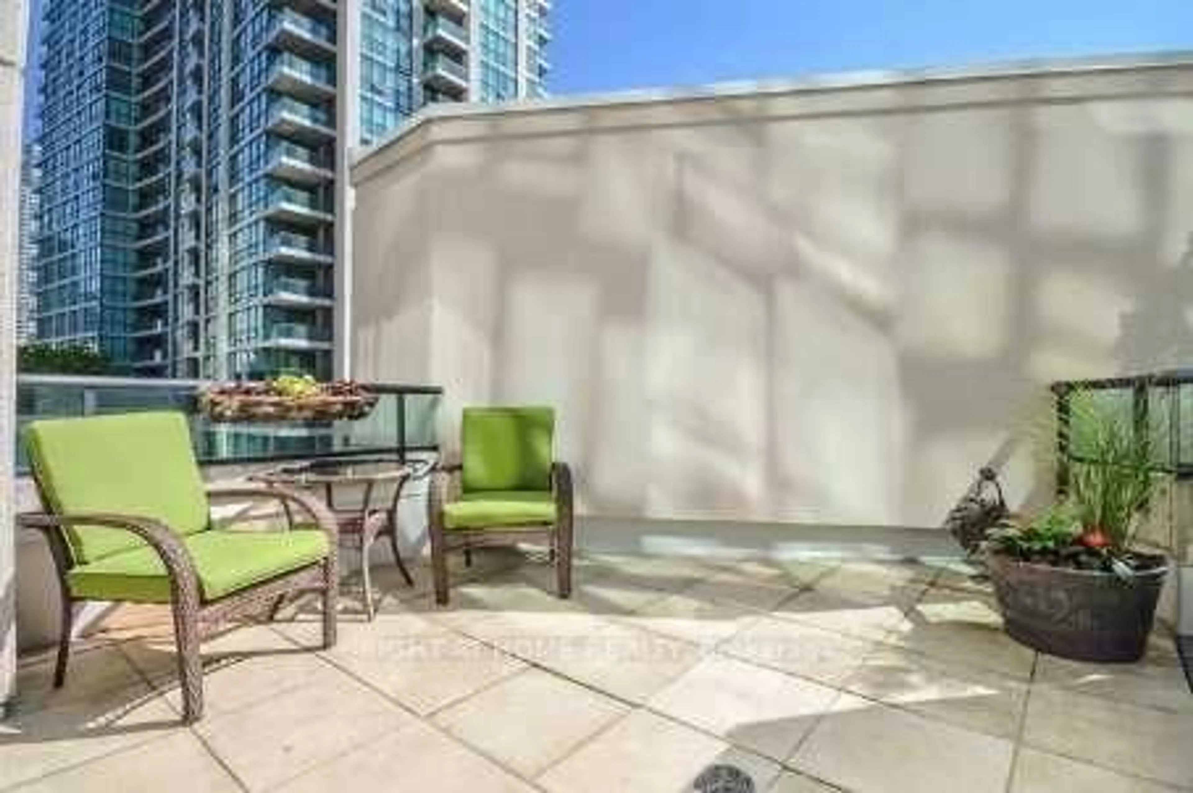 Patio, city buildings view from balcony for 12 Yonge St #503, Toronto Ontario M5E 1Z9