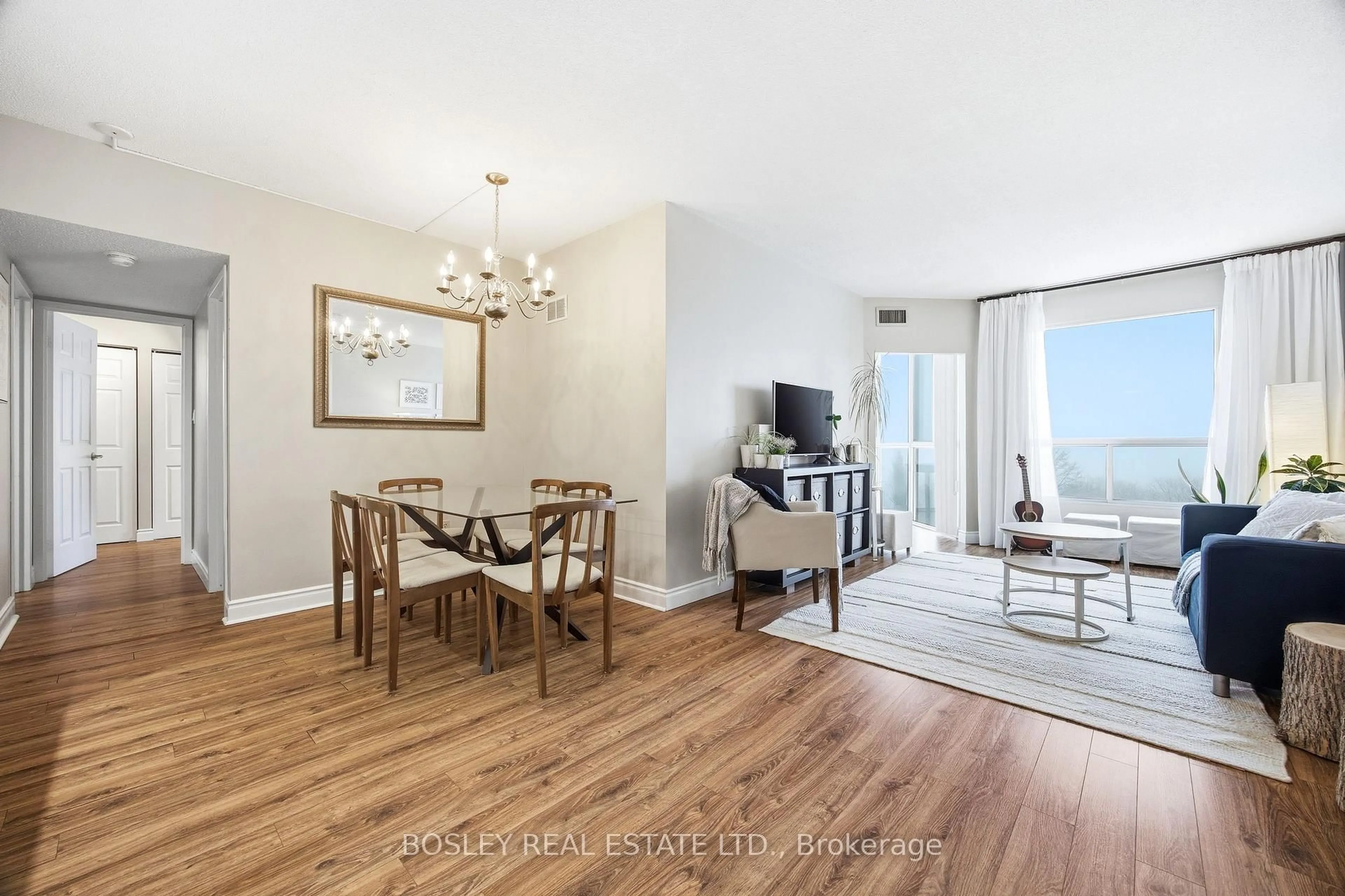 Living room with furniture, wood/laminate floor for 5 Concorde Pl #611, Toronto Ontario M3C 3M8