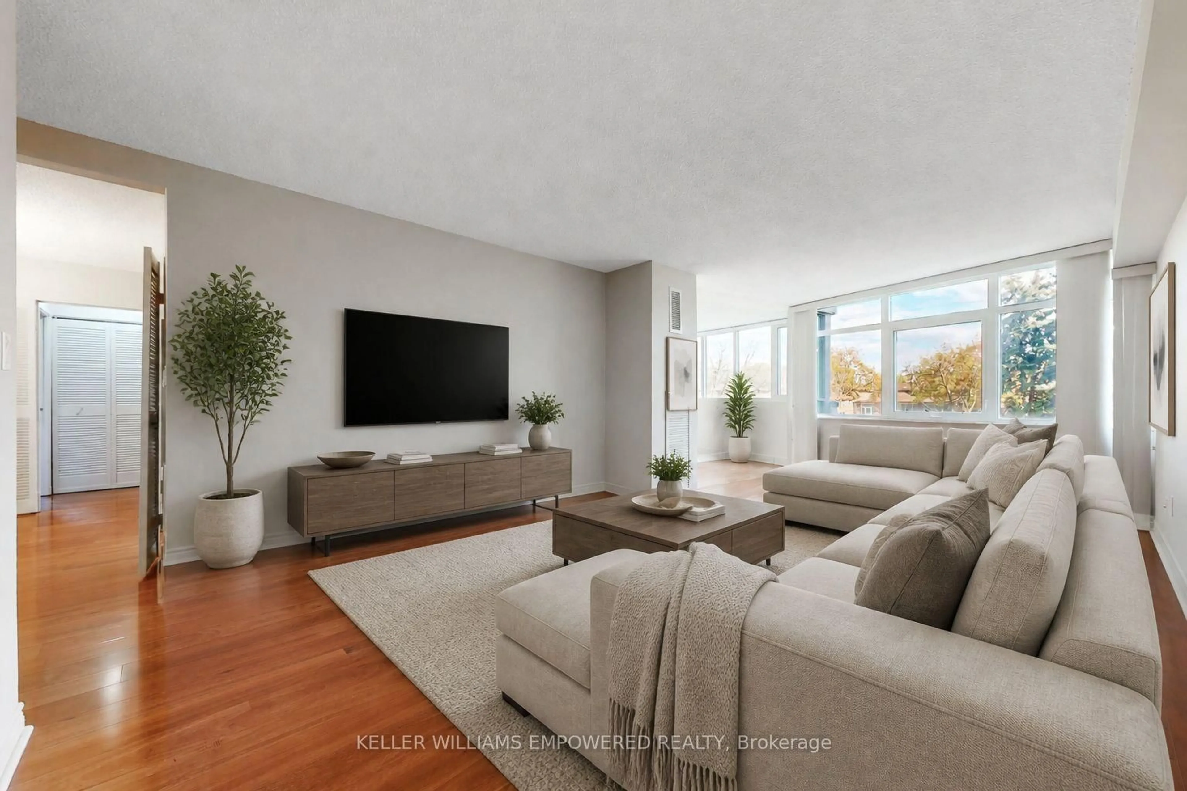 Living room with furniture, unknown for 90 Fisherville Rd #203, Toronto Ontario M2R 3J9