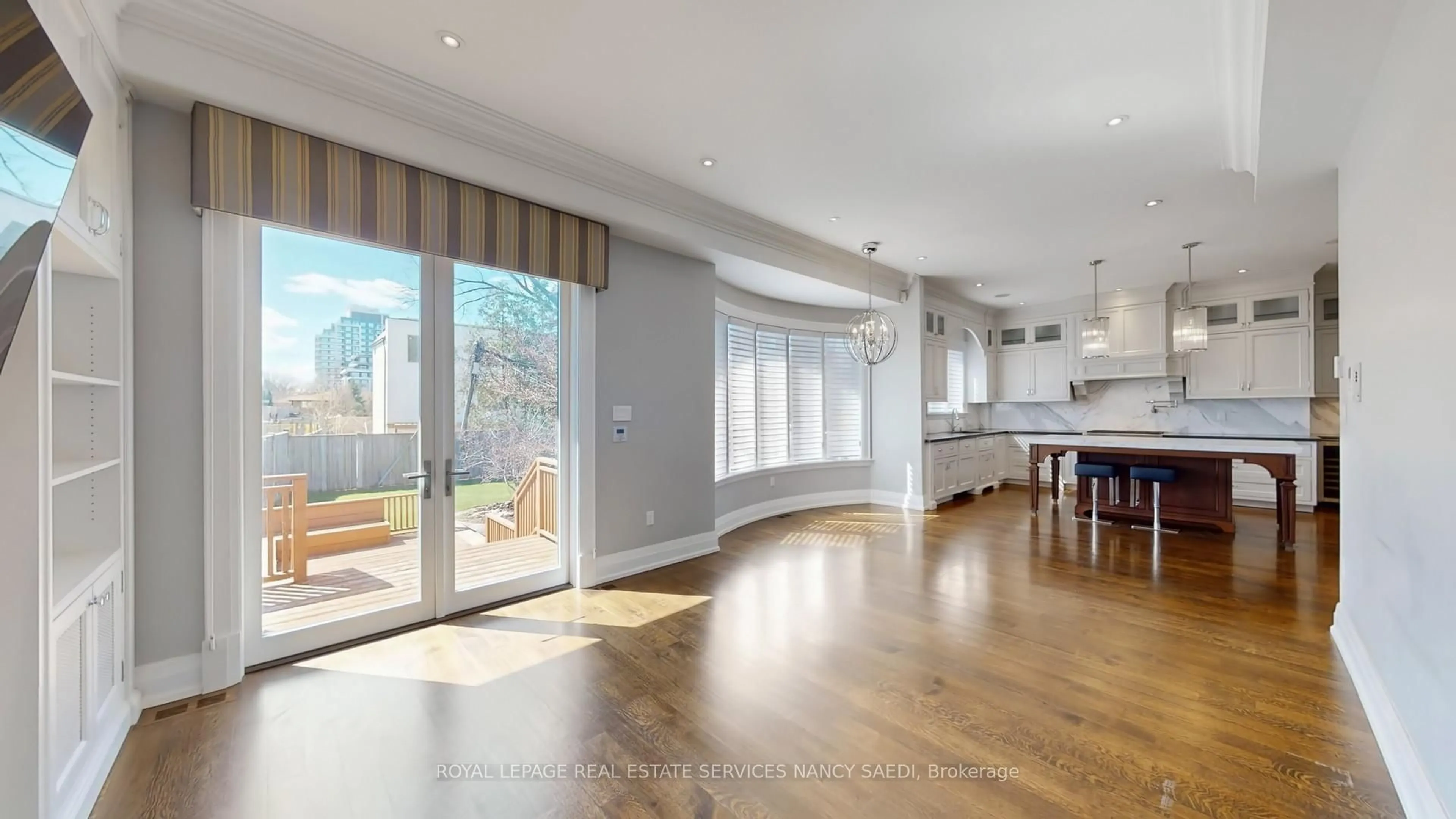 Open concept kitchen, wood/laminate floor for 347 Elmwood Ave, Toronto Ontario M2N 3N2
