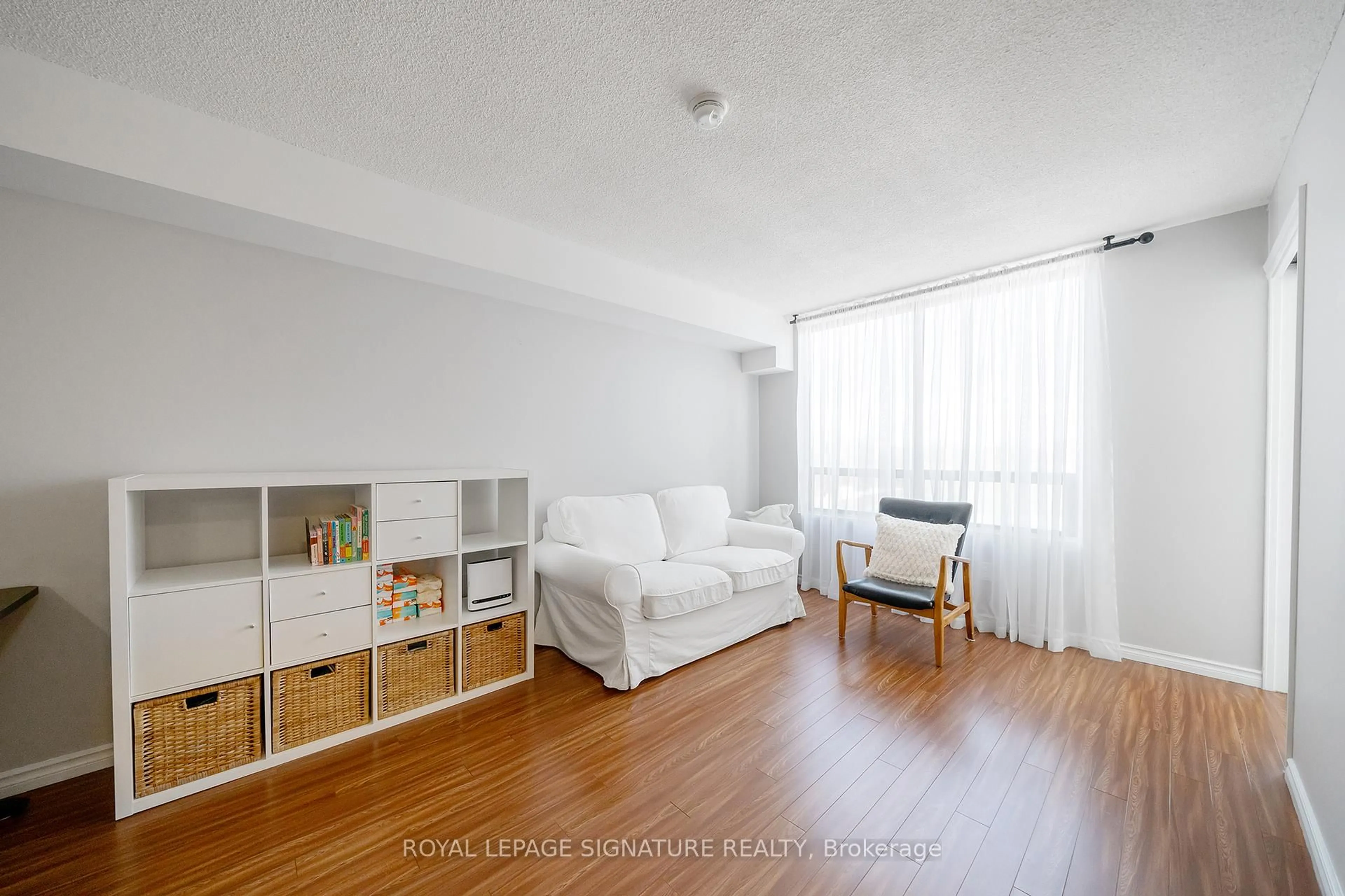 Living room with furniture, wood/laminate floor for 117 Gerrard St #704, Toronto Ontario M5B 2L4