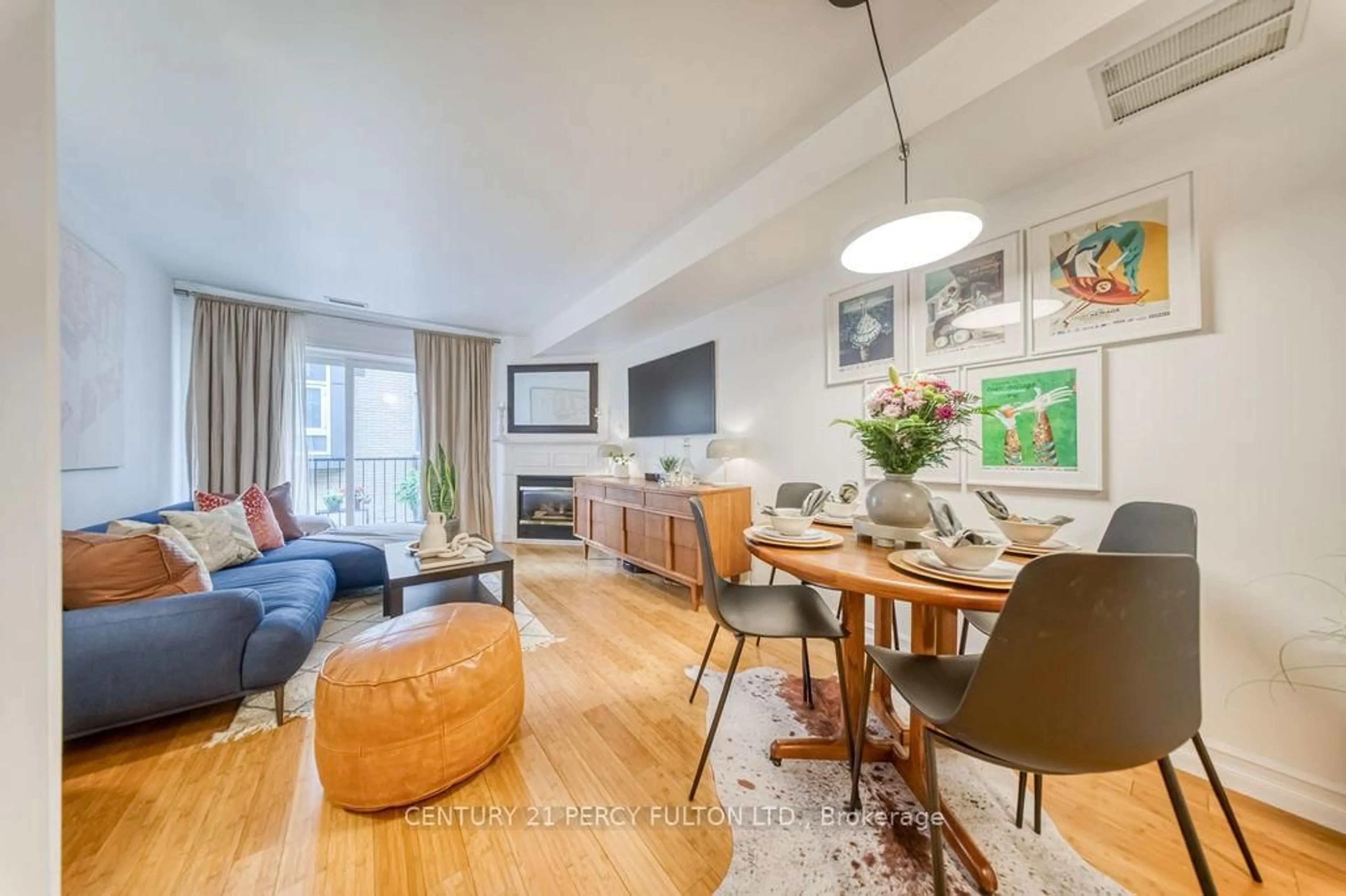 Living room with furniture, wood/laminate floor for 228 St. George St #TH 15, Toronto Ontario M5R 2N5