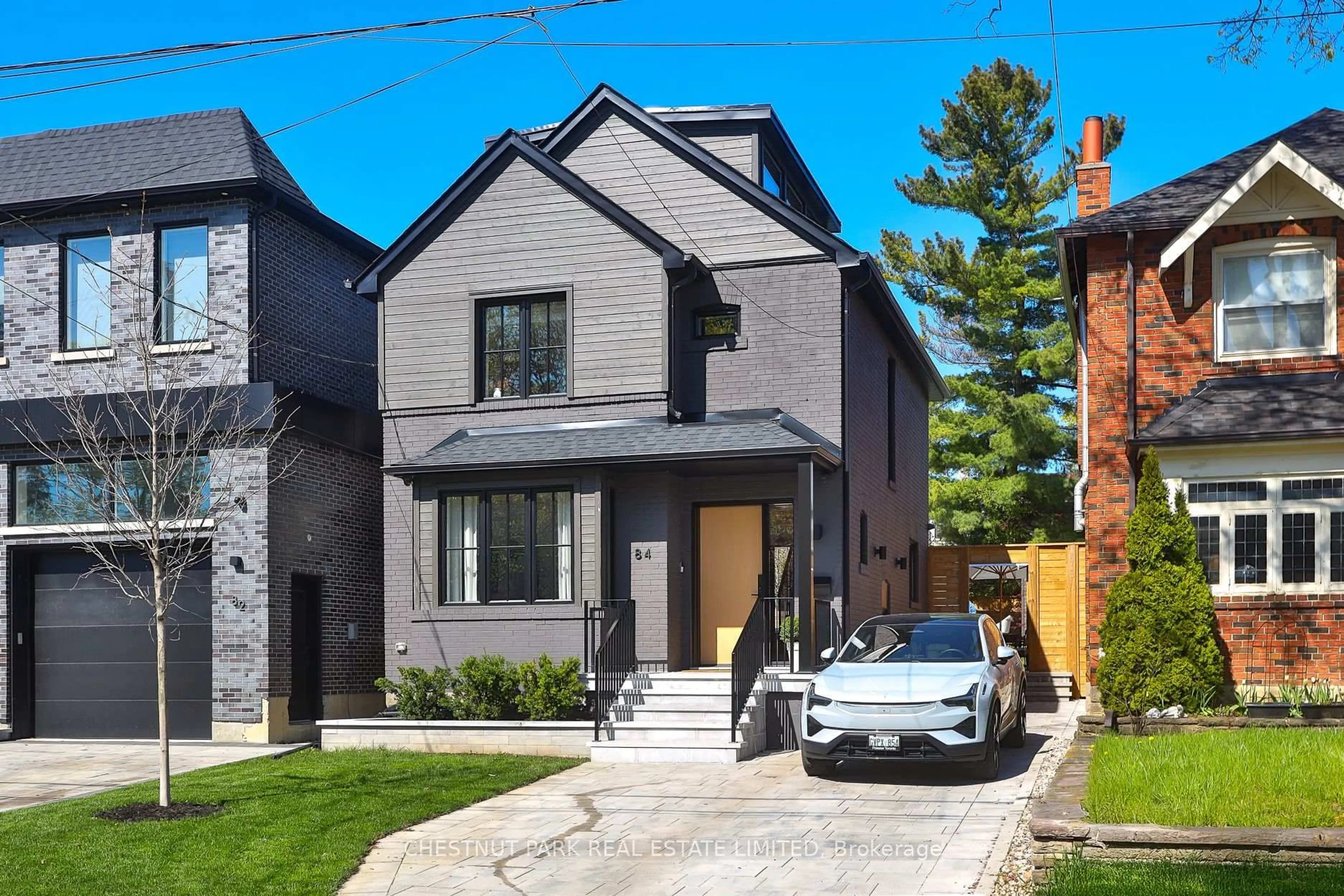 Home with brick exterior material, street for 84 Hanna Rd, Toronto Ontario M4G 3N3