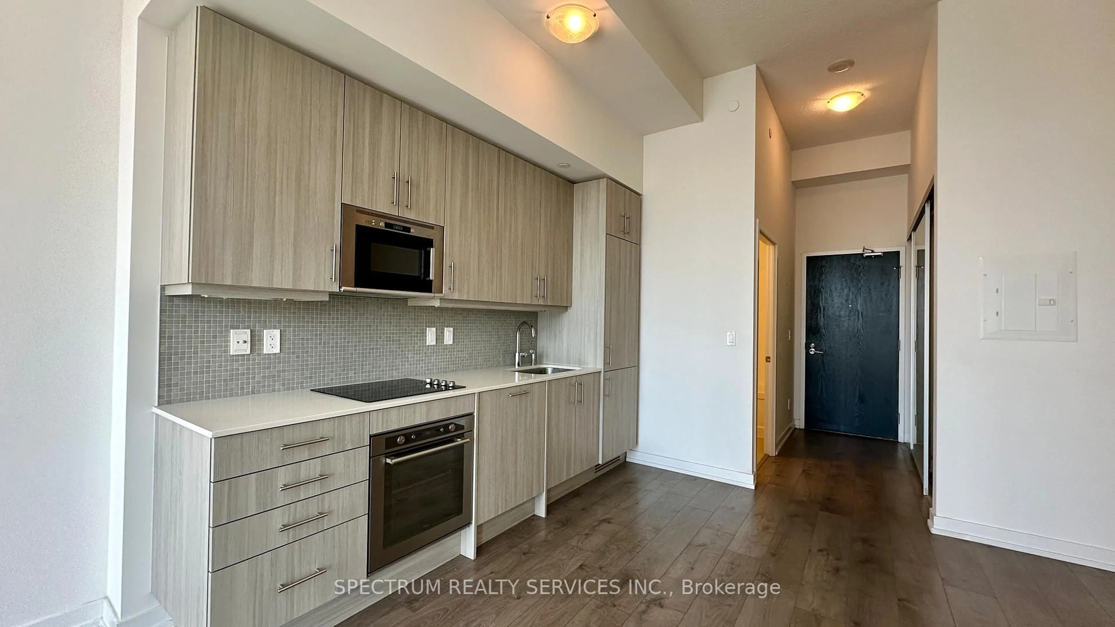 Standard kitchen, wood/laminate floor for 297 College St #1008, Toronto Ontario M5T 0C2