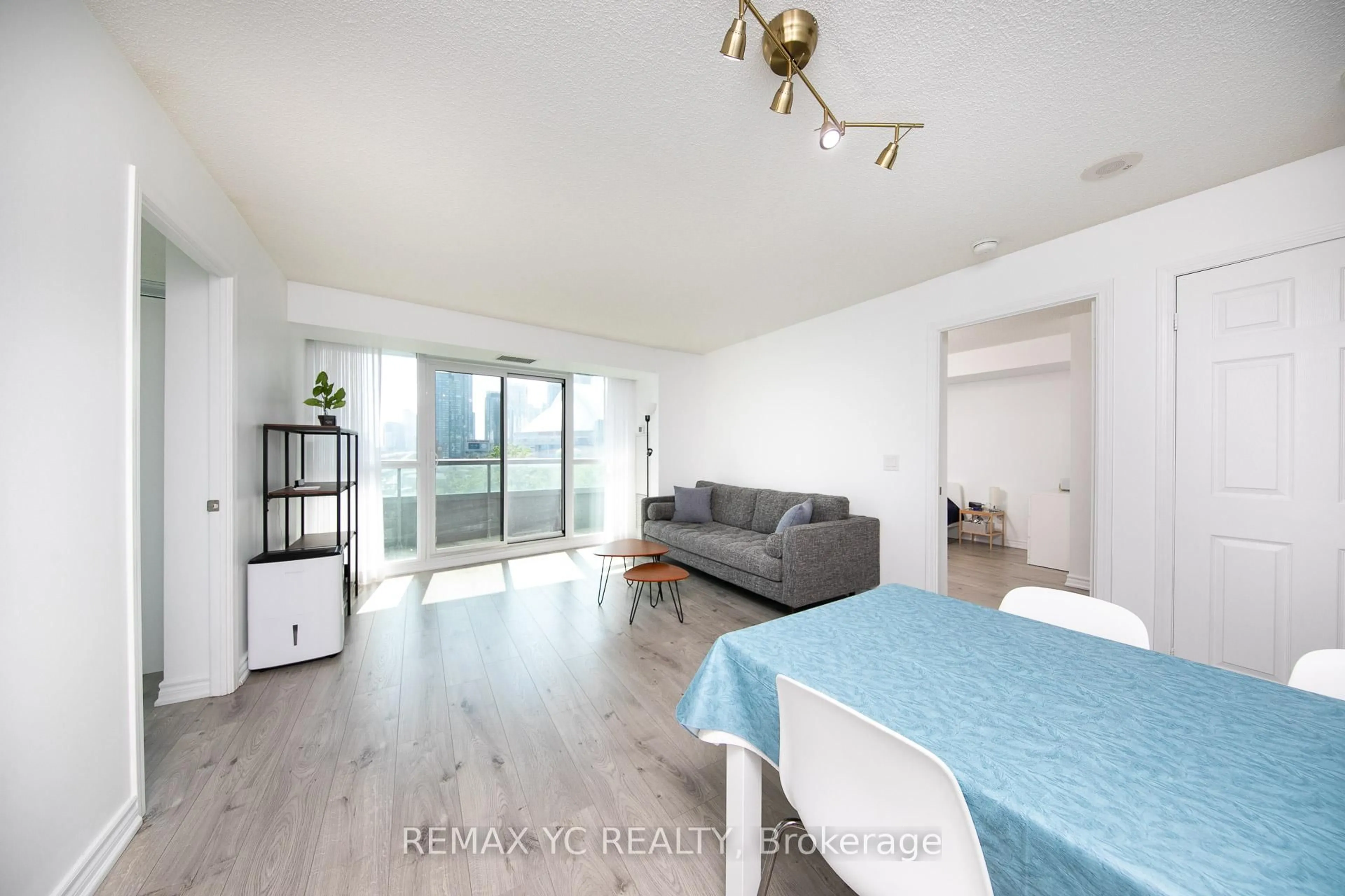 Living room with furniture, wood/laminate floor for 25 Lower Simcoe St #808, Toronto Ontario M5J 3A1