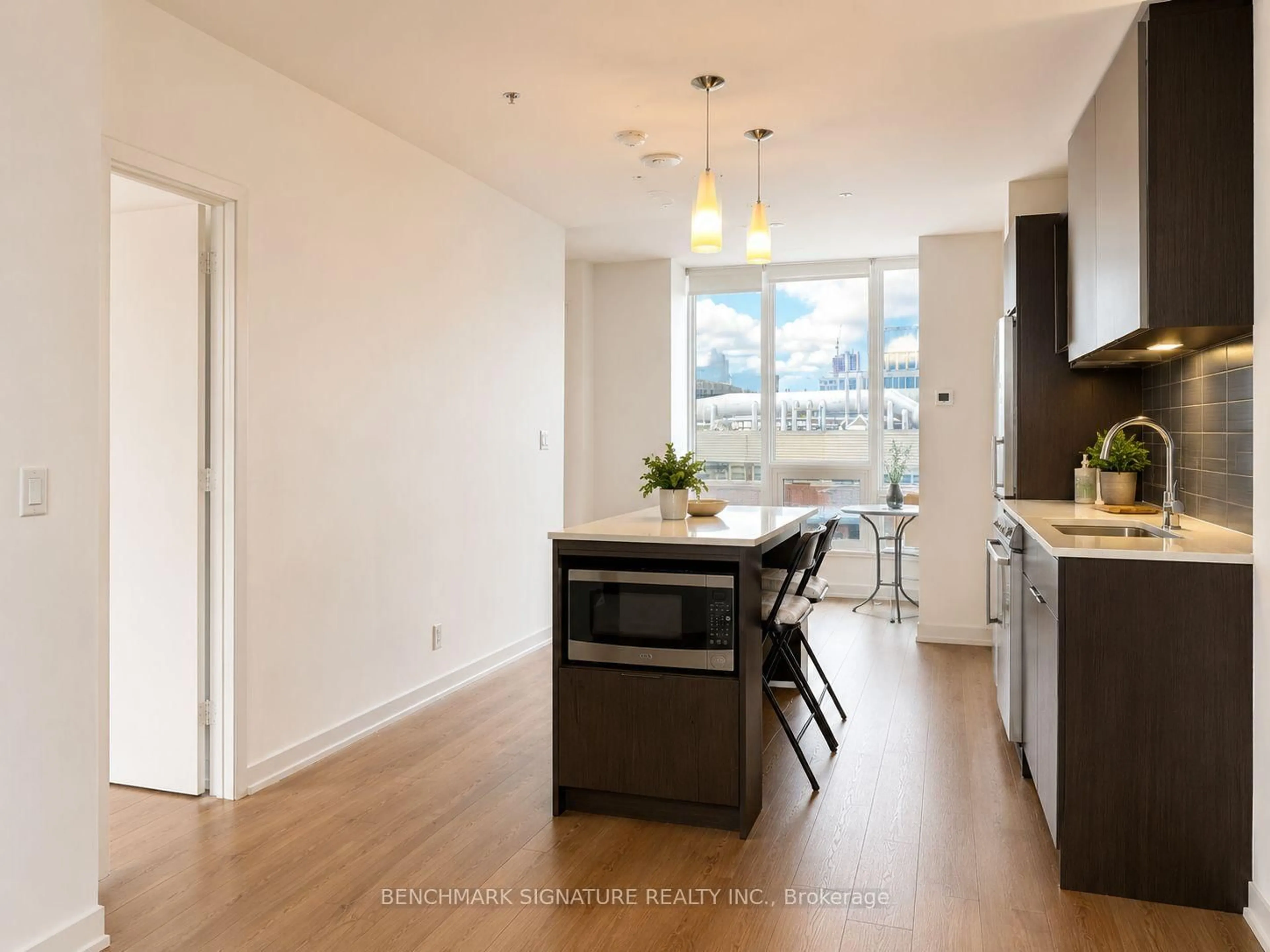 Open concept kitchen, wood/laminate floor for 203 College St #606, Toronto Ontario M5T 0C8