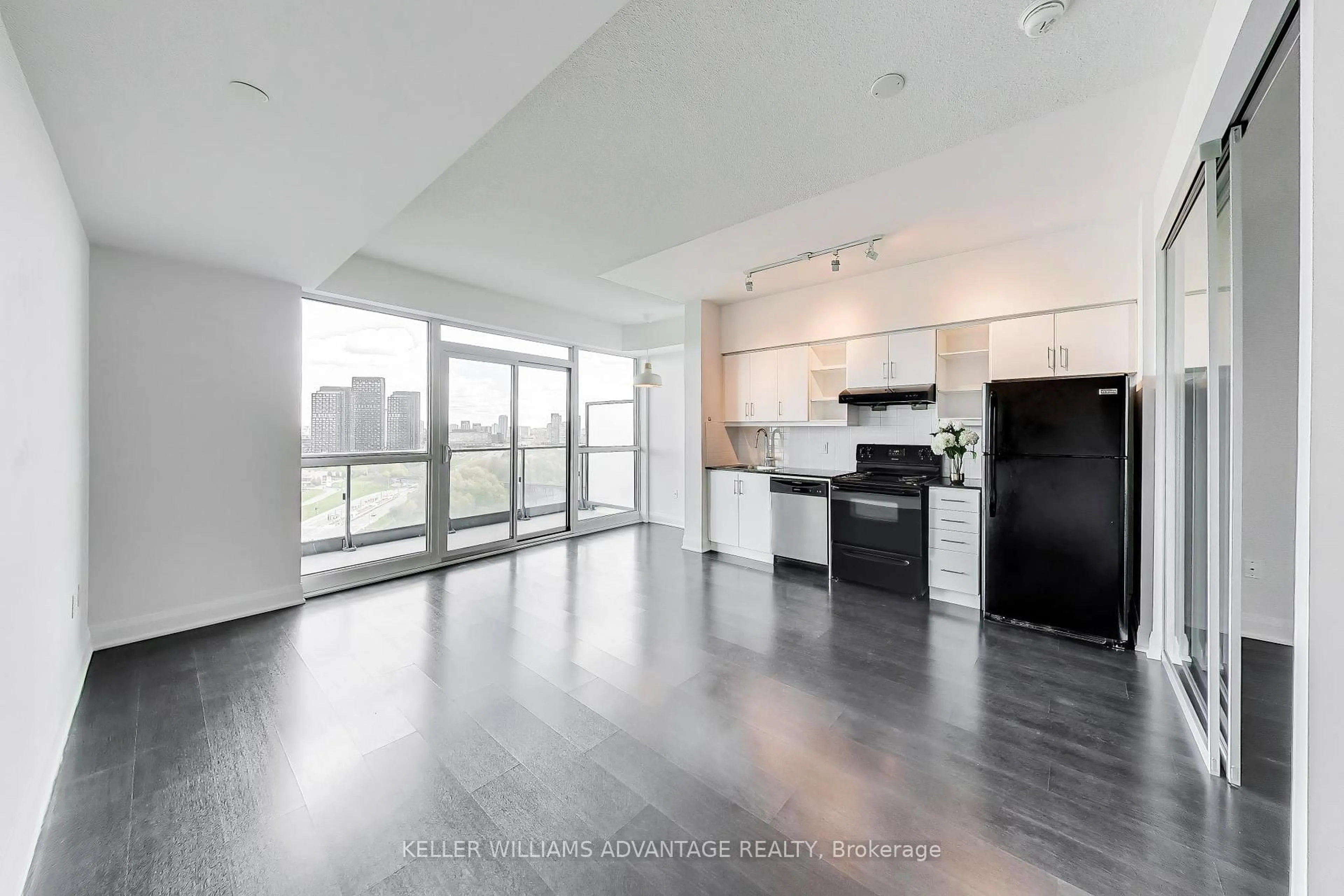 Open concept kitchen, wood/laminate floor for 160 Vanderhoof Ave #1718, Toronto Ontario M4G 0B7