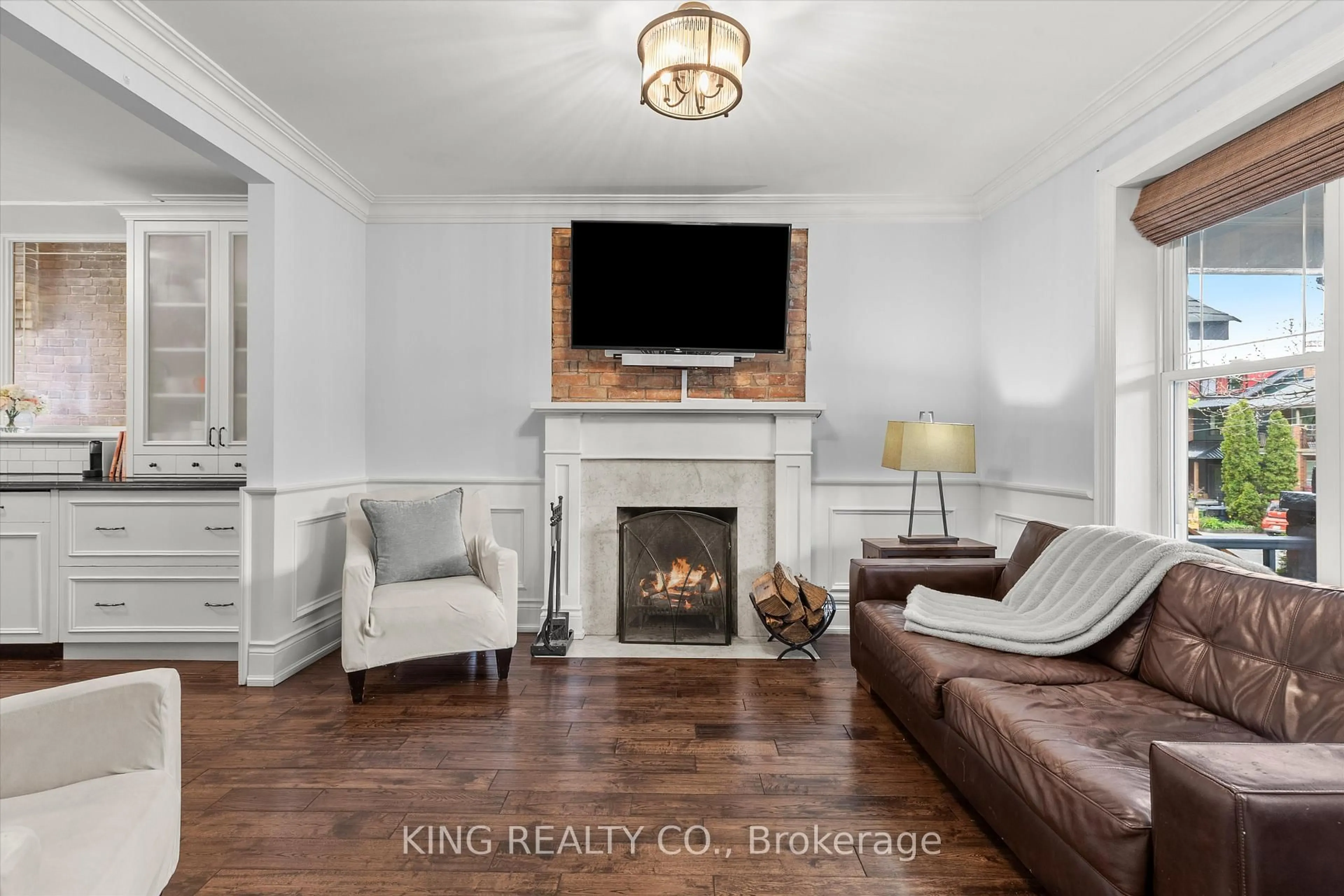 Living room with furniture, wood/laminate floor for 265 Glenholme Ave, Toronto Ontario M6E 3C7