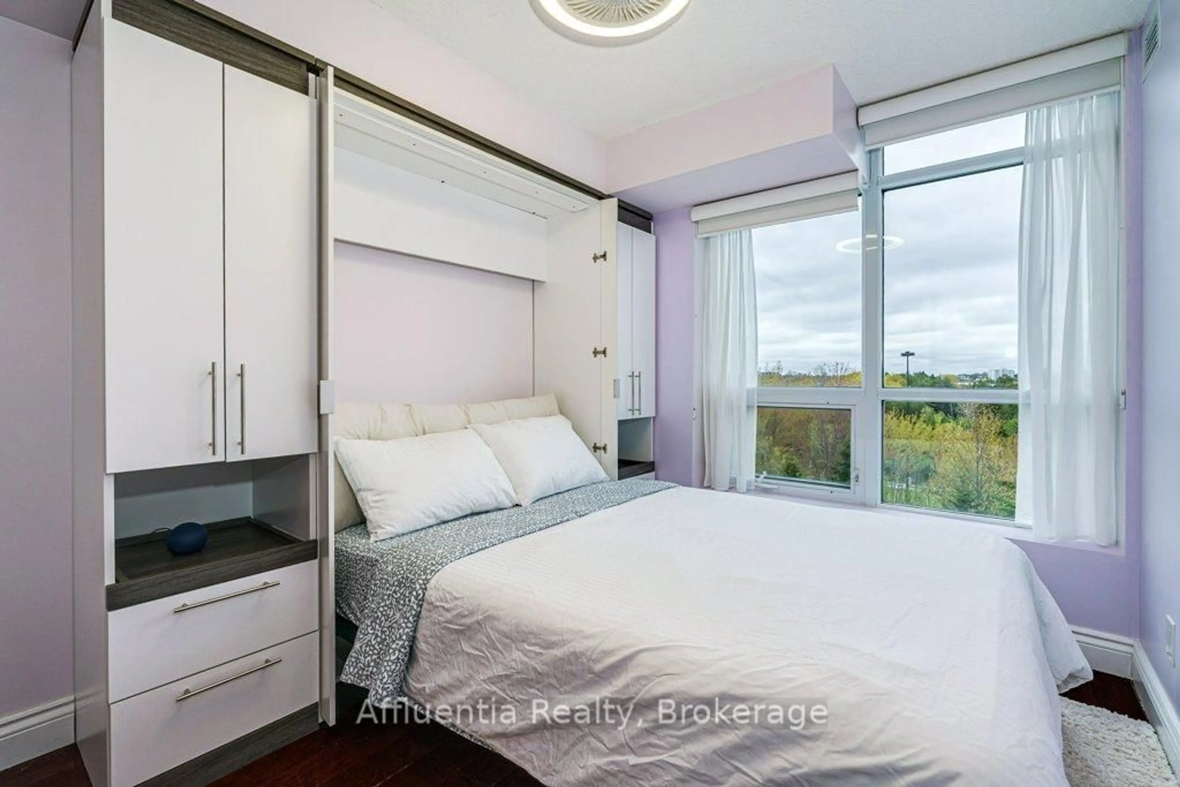 Bedroom with bed, wood/laminate floor for 120 Dallimore Circ #408, Toronto Ontario M3C 4J1