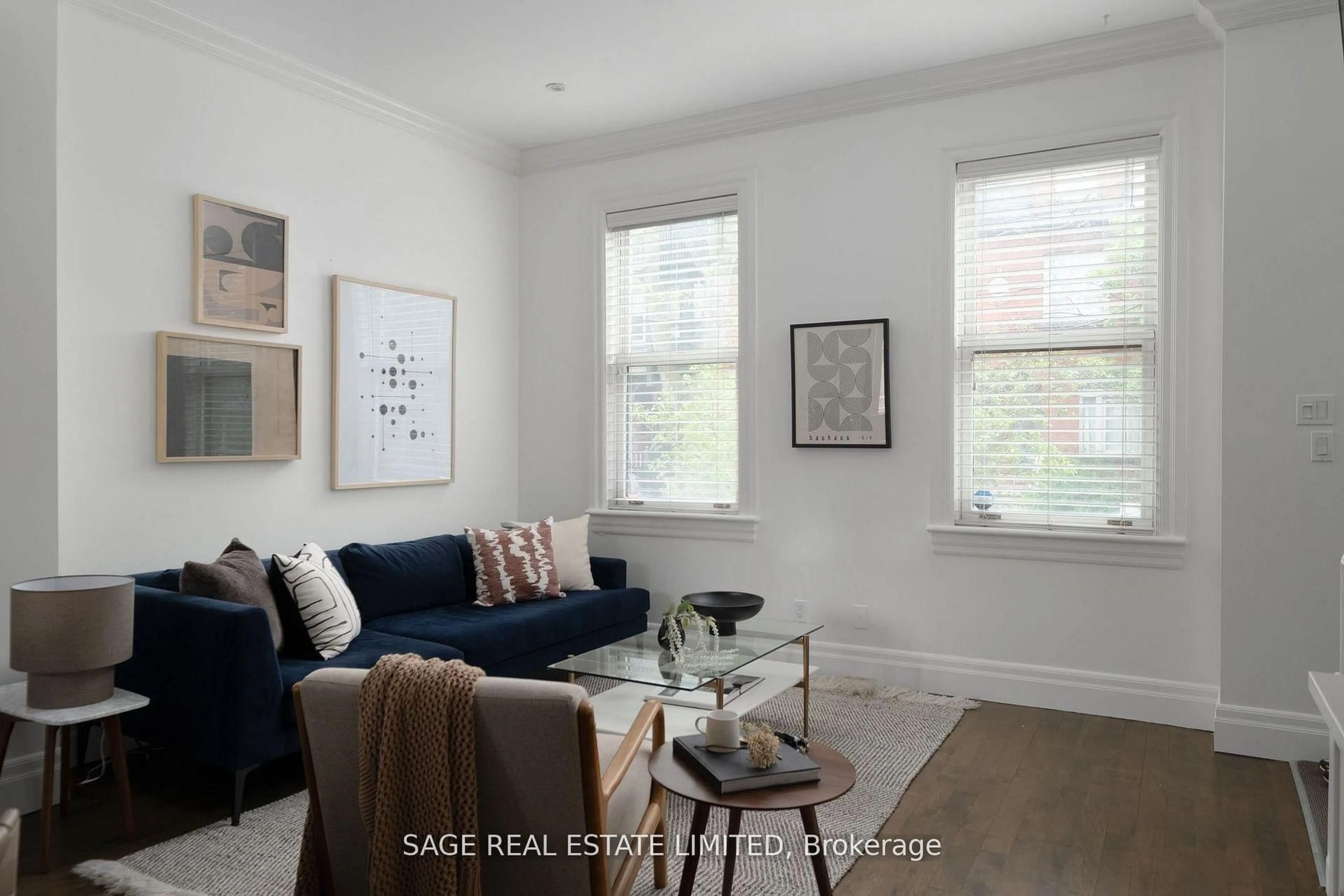 Living room with furniture, wood/laminate floor for 438 Sumach St, Toronto Ontario M4X 1V7