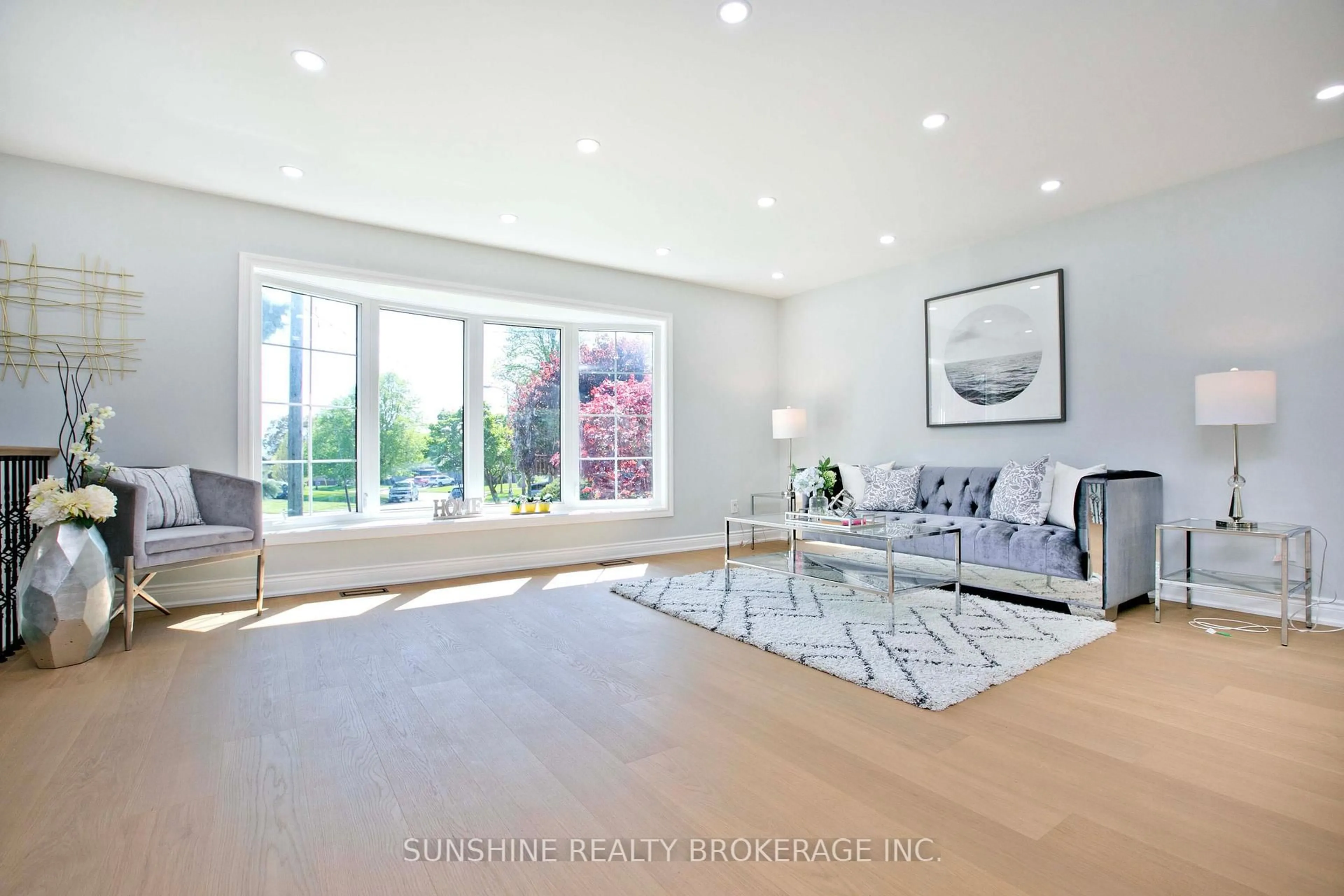 Living room with furniture, wood/laminate floor for 26 Lantana Crt, Toronto Ontario M4A 2H8