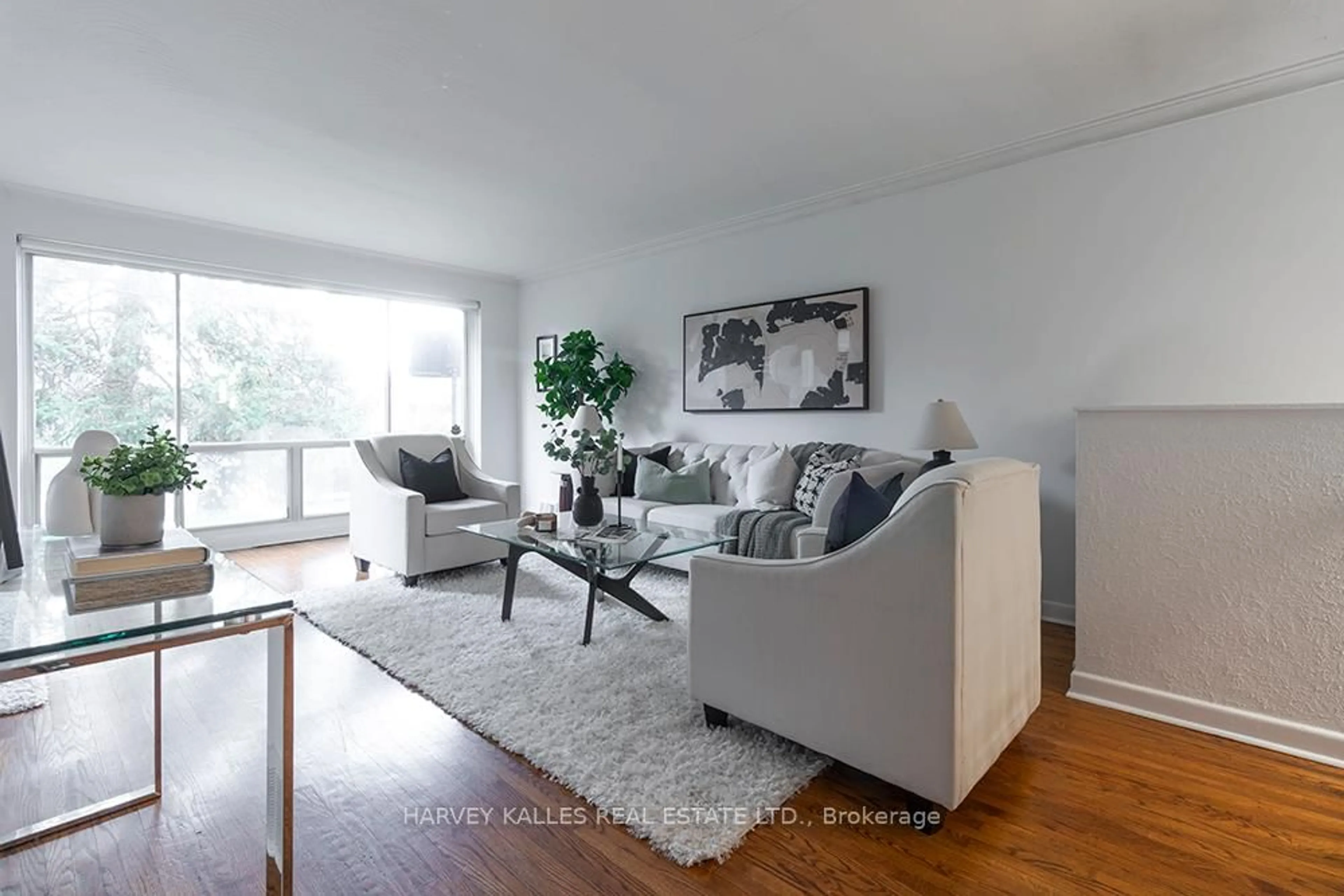 Living room with furniture, wood/laminate floor for 135 Combe Ave, Toronto Ontario M3H 4K2