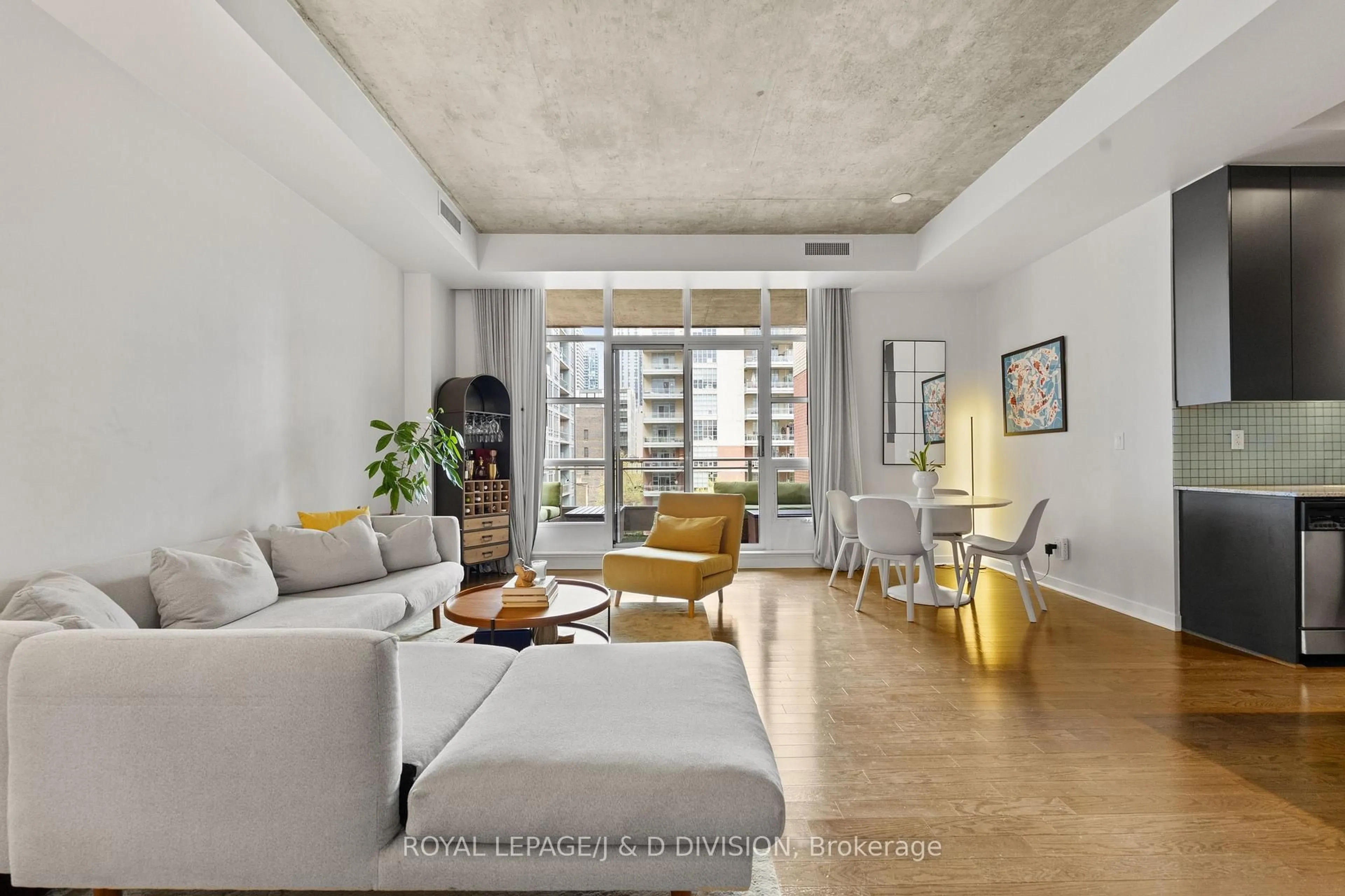 Living room with furniture, cement floor for 19 Brant St #508, Toronto Ontario M5V 2L2